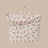 A cream colored canvas tote bag with a red and green flower pattern. 