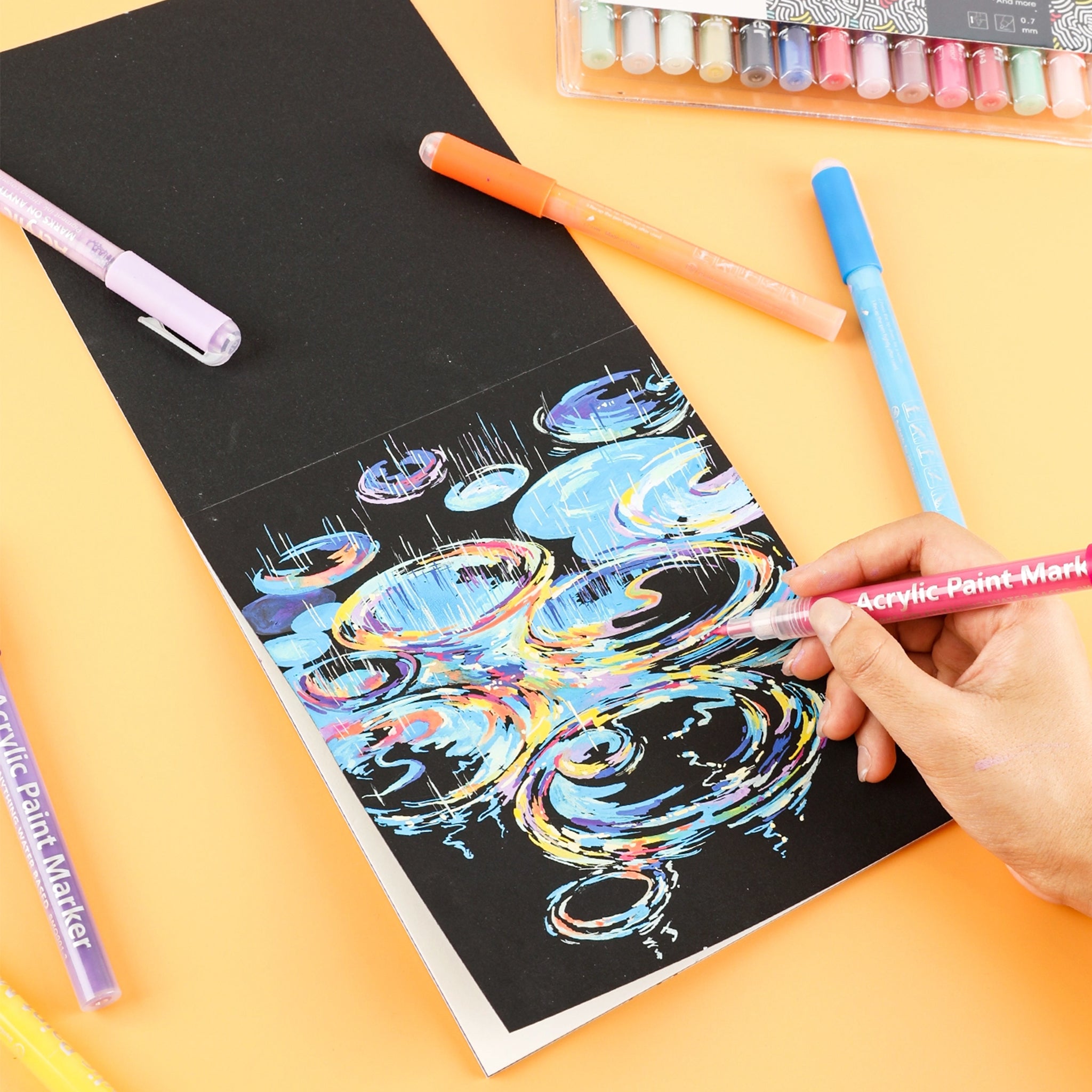 A pack of fine tip paint markers. 