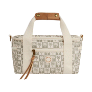 On a white background is a sage and ivory palm tree checker patterned cooler bag with leather and canvas strap details.