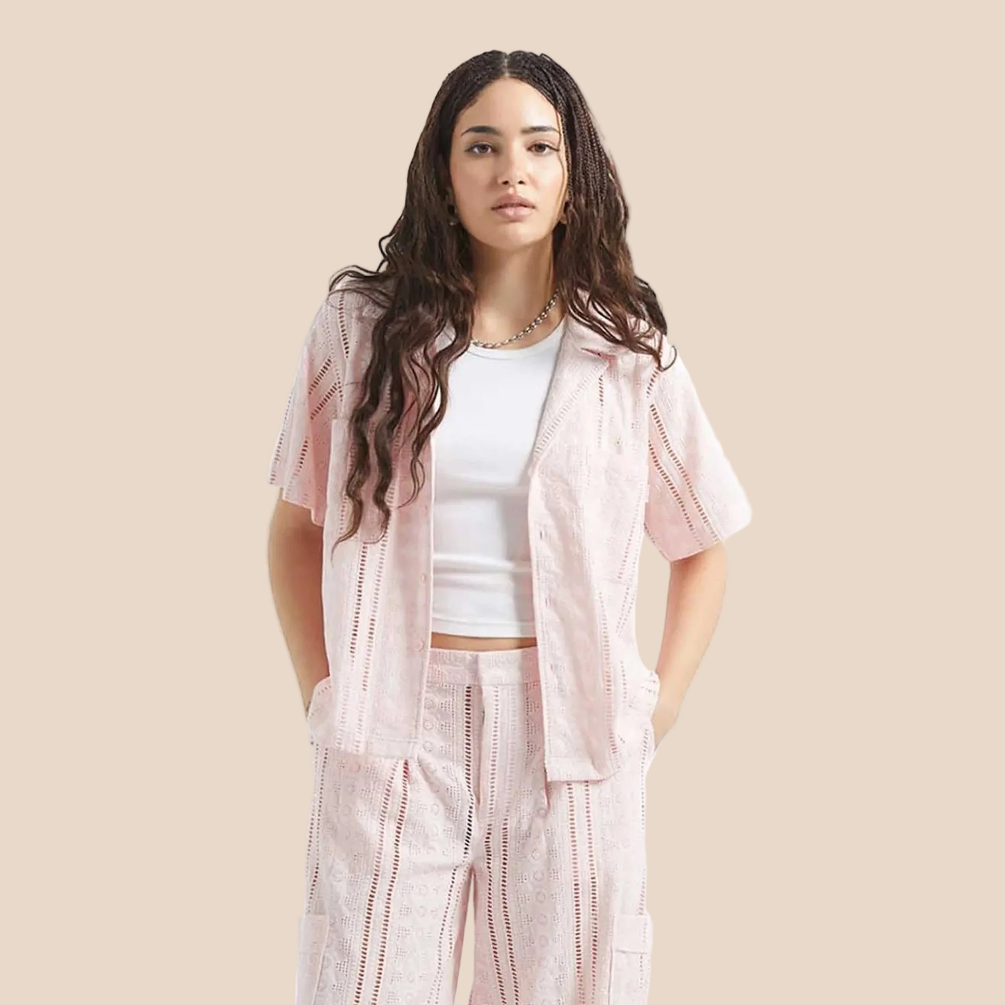 An eyelet pink short sleeve button up. 