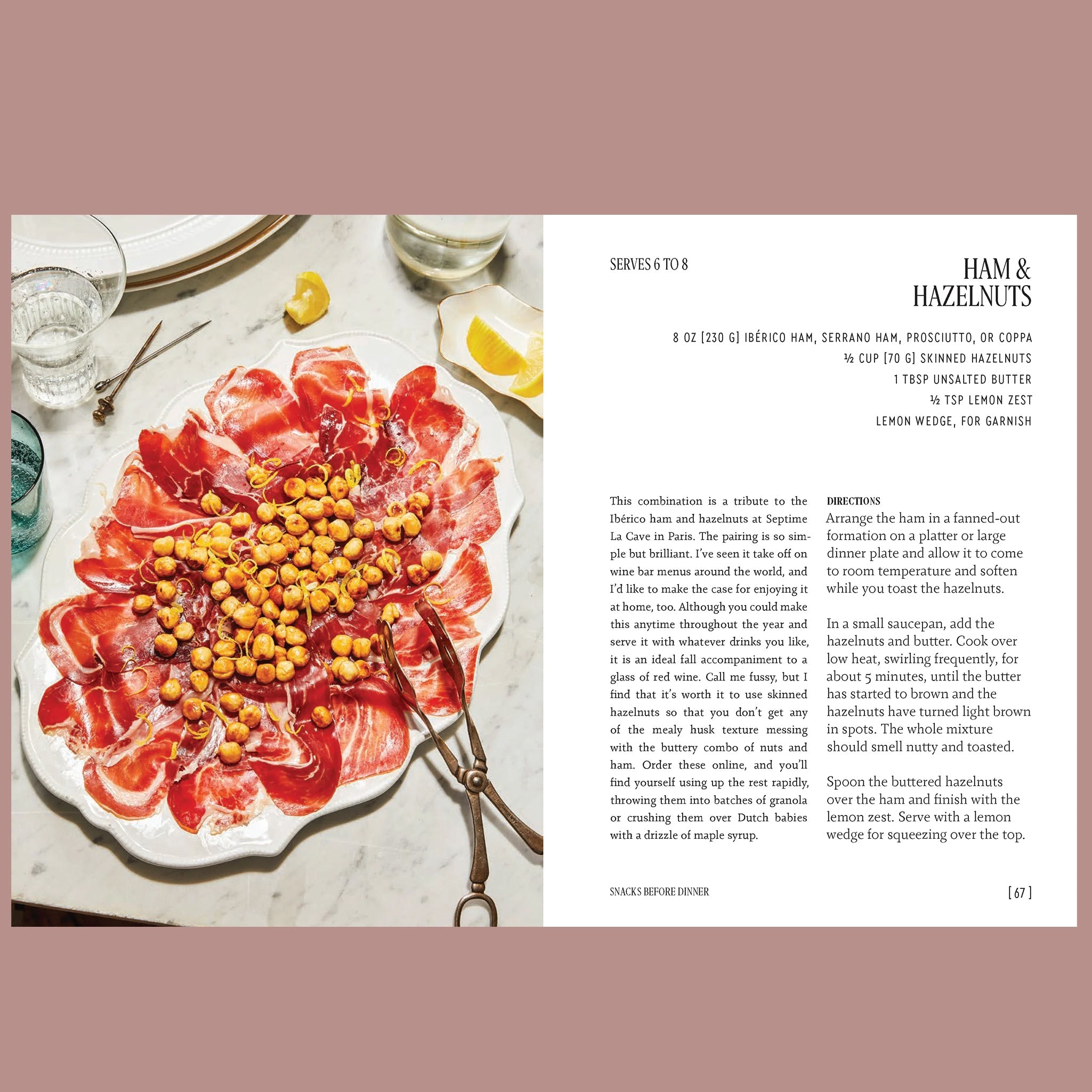 Open cookbook page with a recipe for Ham &amp; Hazelnuts, pictured as a platter of sliced cured ham topped with toasted hazelnuts and served with lemon wedges.