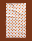 A white and orange pumpkin kitchen tea towel.
