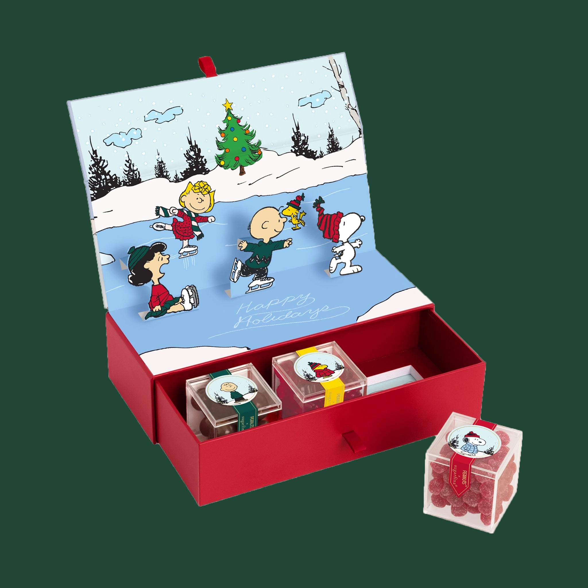 A three piece box of assorted candies with the characters of Peanuts on the boxes. 