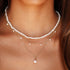 A pearl bead and gold chain necklace. 
