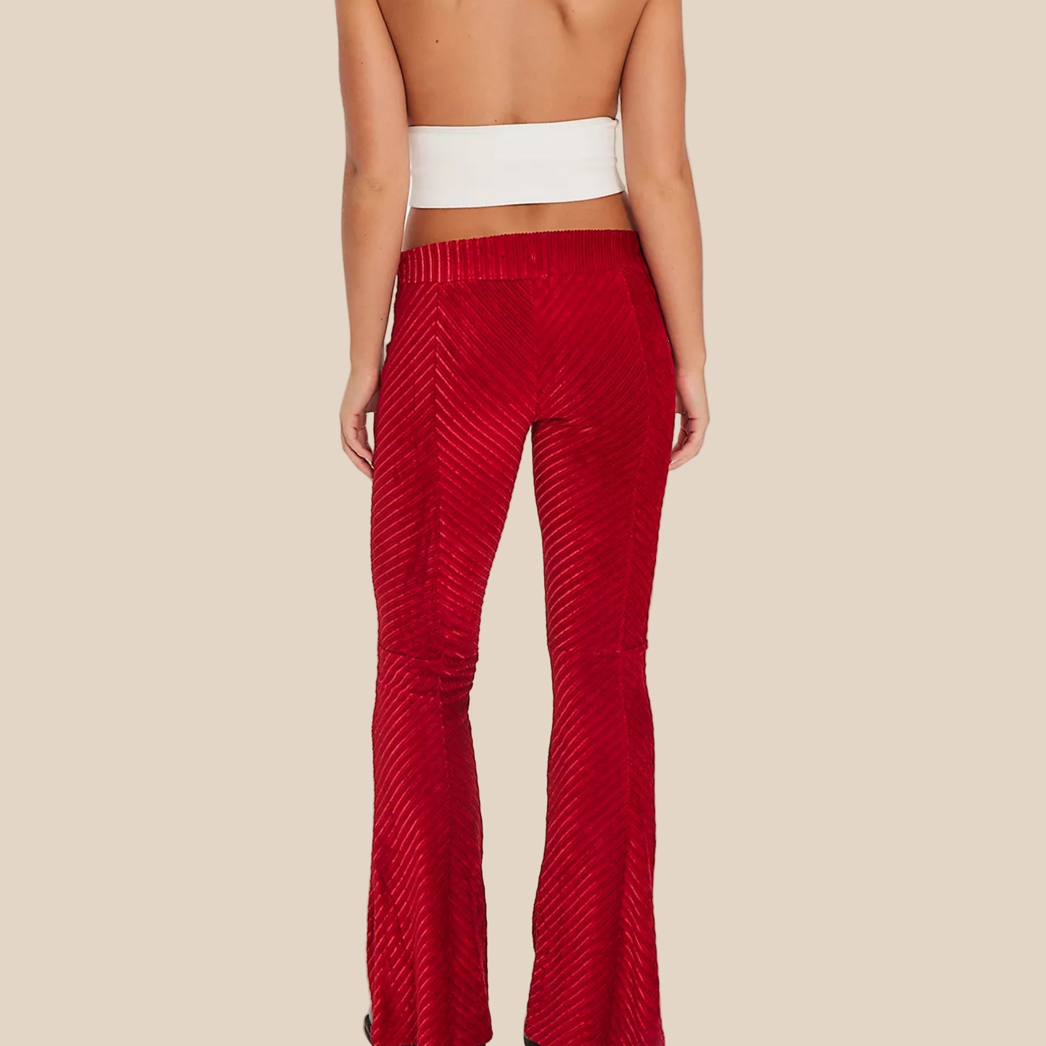 A red pair of velvet pull on pants. 
