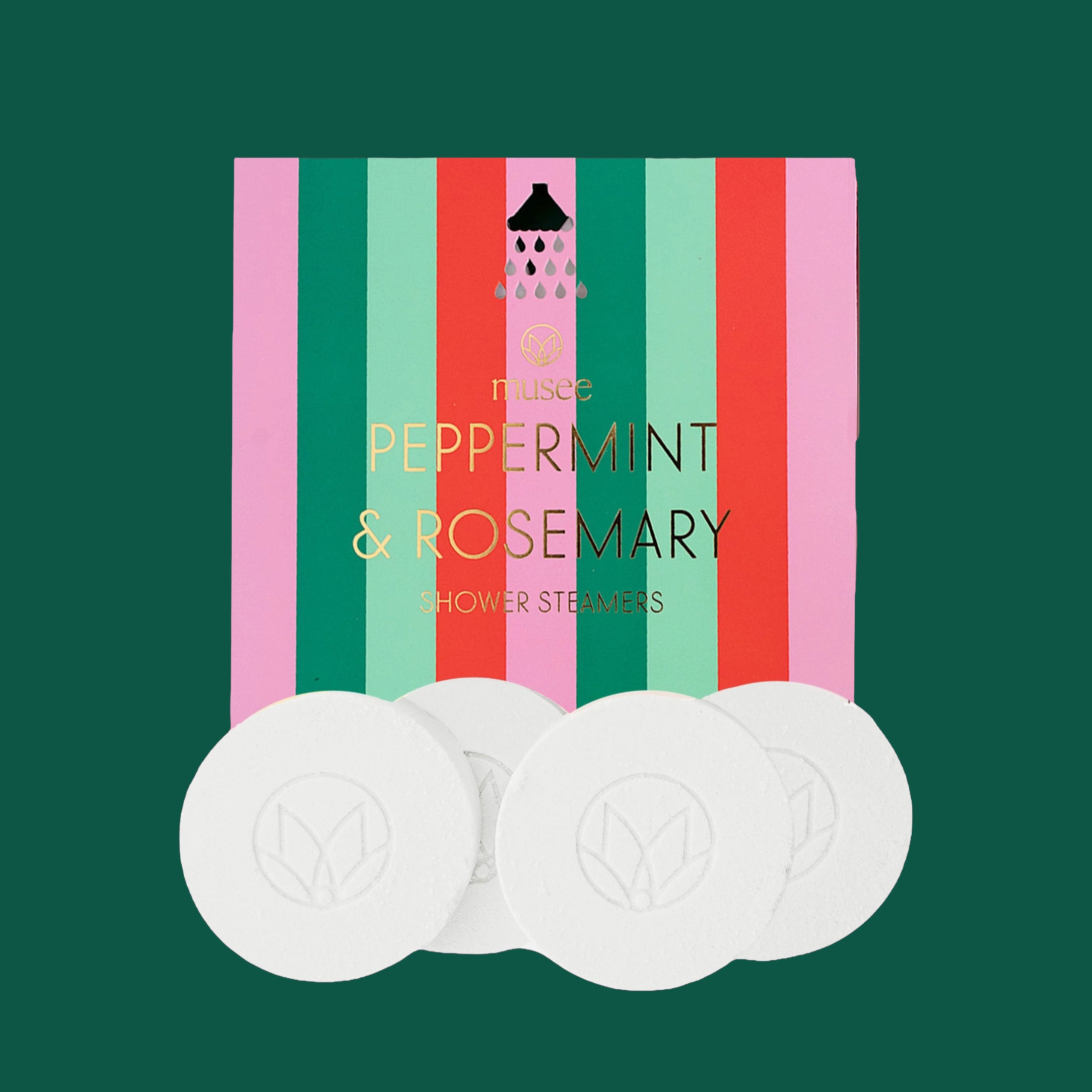 A box of Musee Peppermint & Rosemary Shower Steamers with bold vertical stripes in pink, green, red, and mint is shown against a dark green background. Four white round steamers are arranged in front of the box.