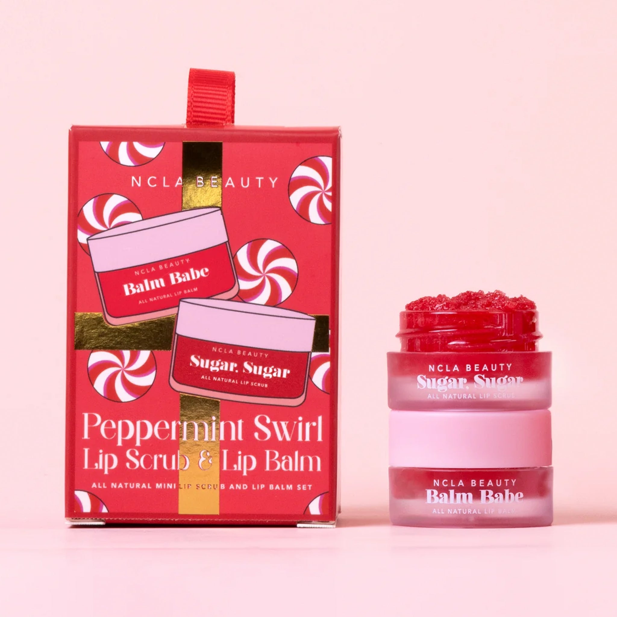 A set of one lip scrub and lip balm in a red package