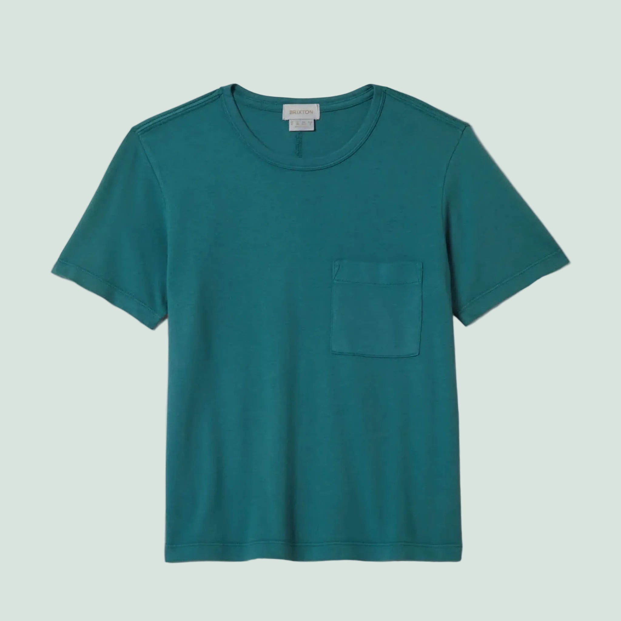 A teal blue short sleeve shirt with a front pocket. 