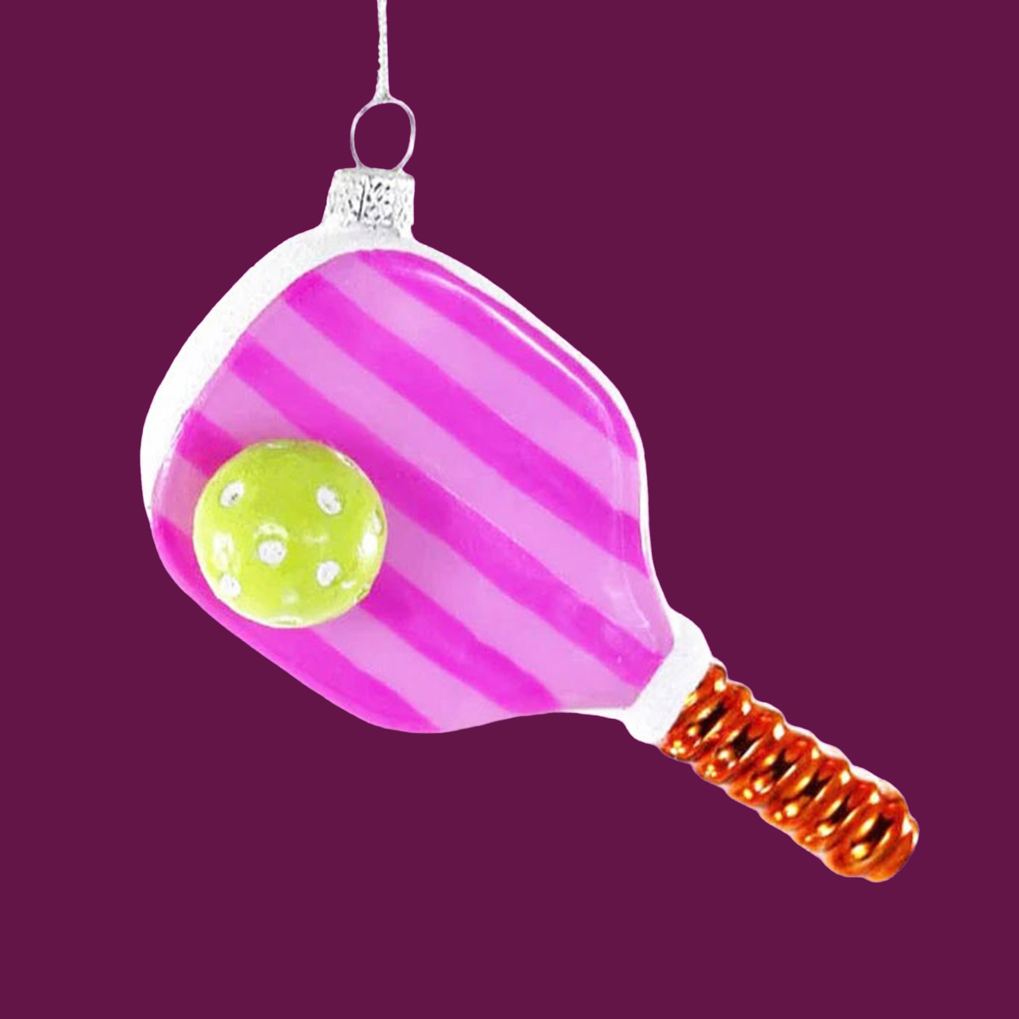 A pink striped pickle ball paddle shaped ornament. 