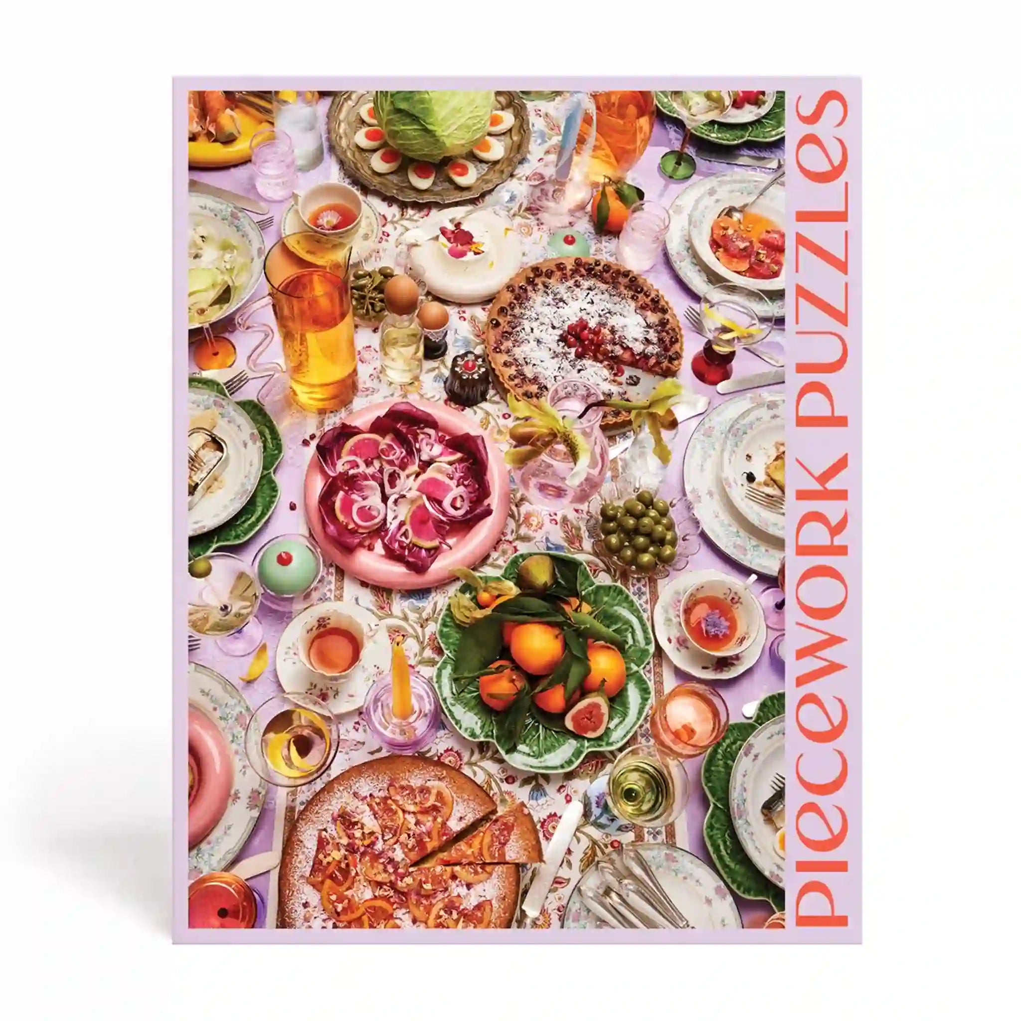 The back of the box that read features a colorful tablescape of drinks and food along with red text along the side that reads, "Piecework Puzzles". 