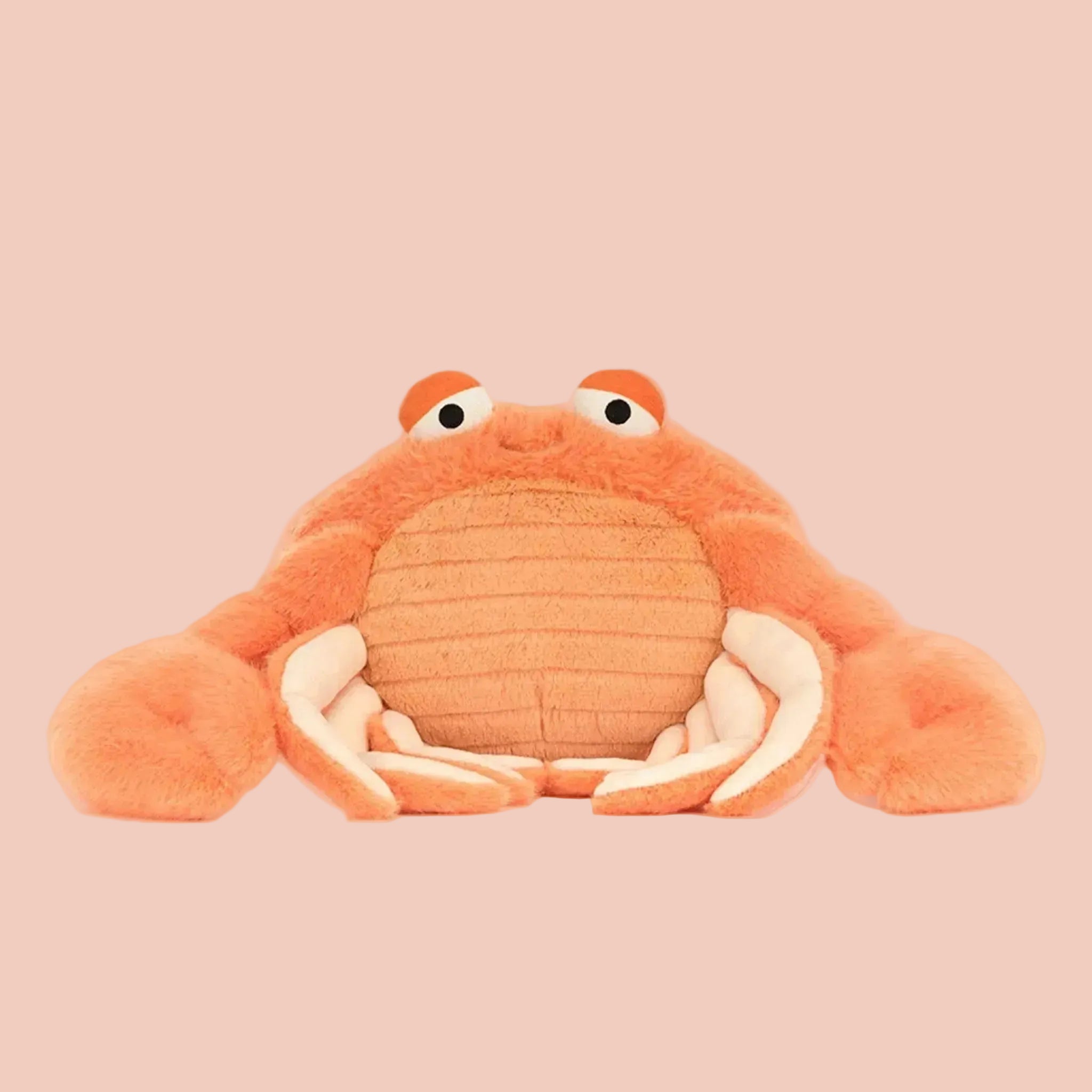 Plush crab toy on a white background