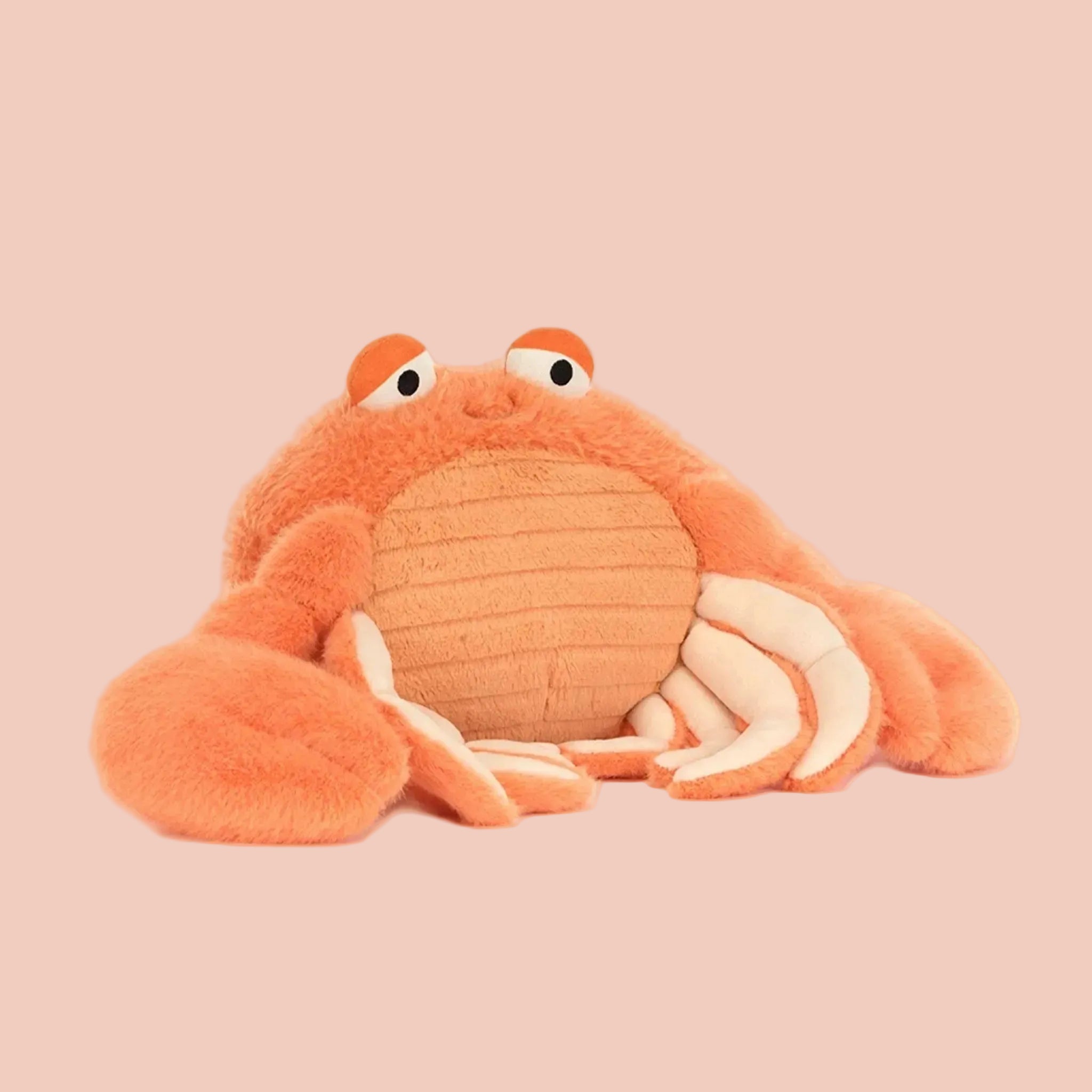 Plush crab toy on a white background