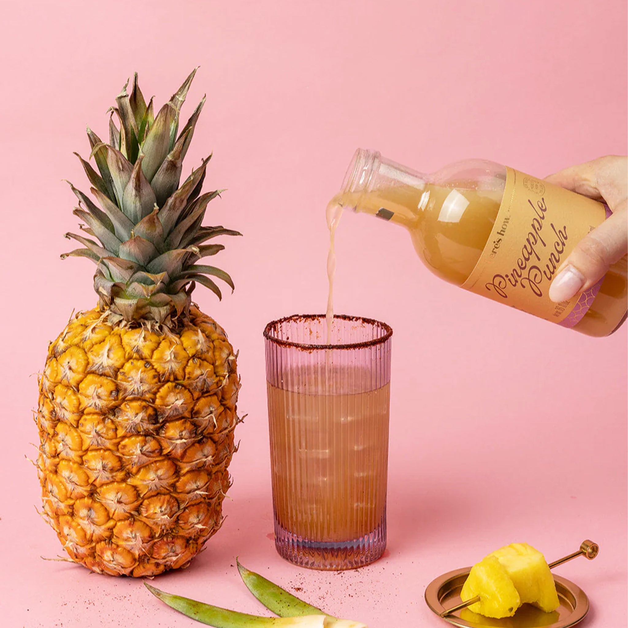 A bottle of pineapple punch cocktail mixer. 