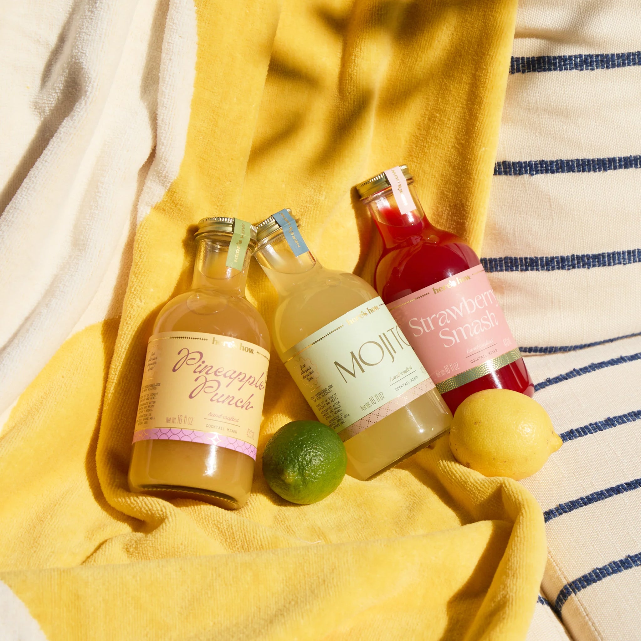 A clear bottle of yellow cocktail mix with a label that reads, 'Pineapple Punch'. 