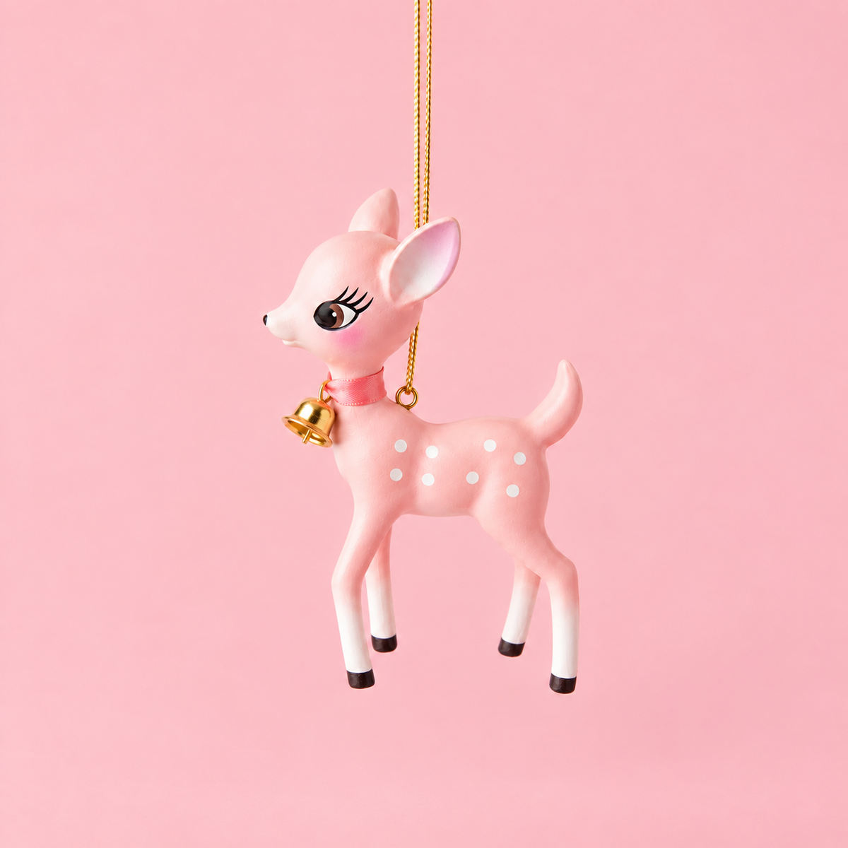 A pink retro deer shaped ornament. 