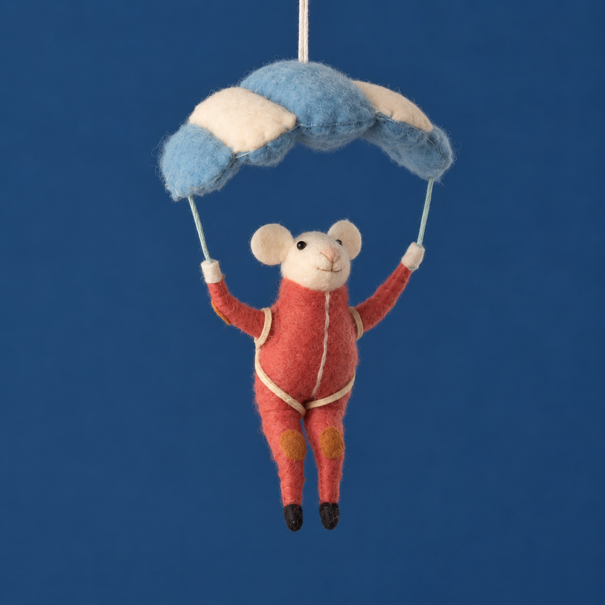 A parasailing felt mouse ornament. 