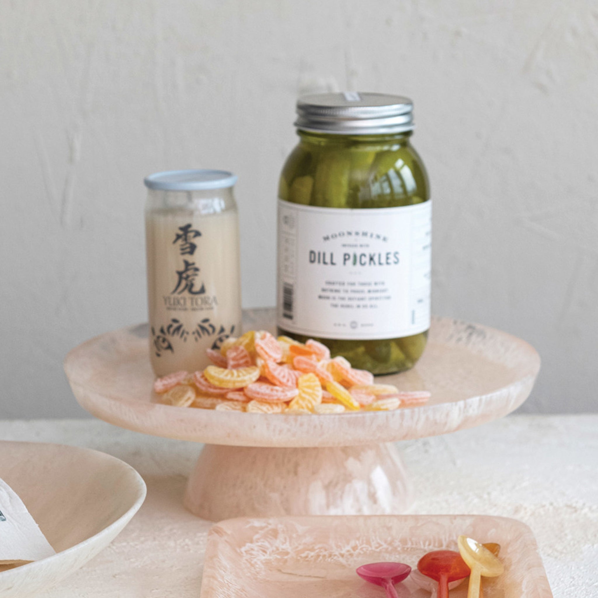 A light pink resin pedestal tray. 