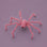 A pink furry spider decoration.