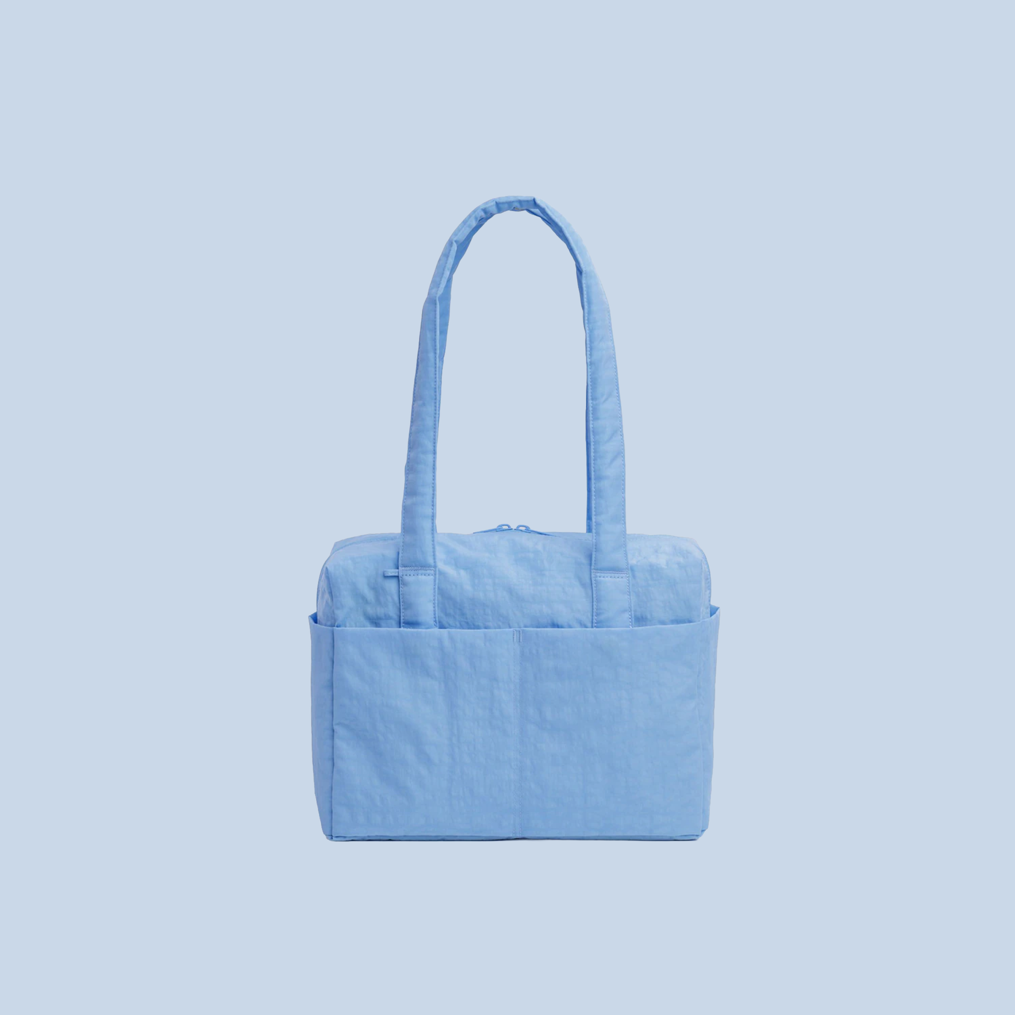 A powder blue nylon shoulder bag.
