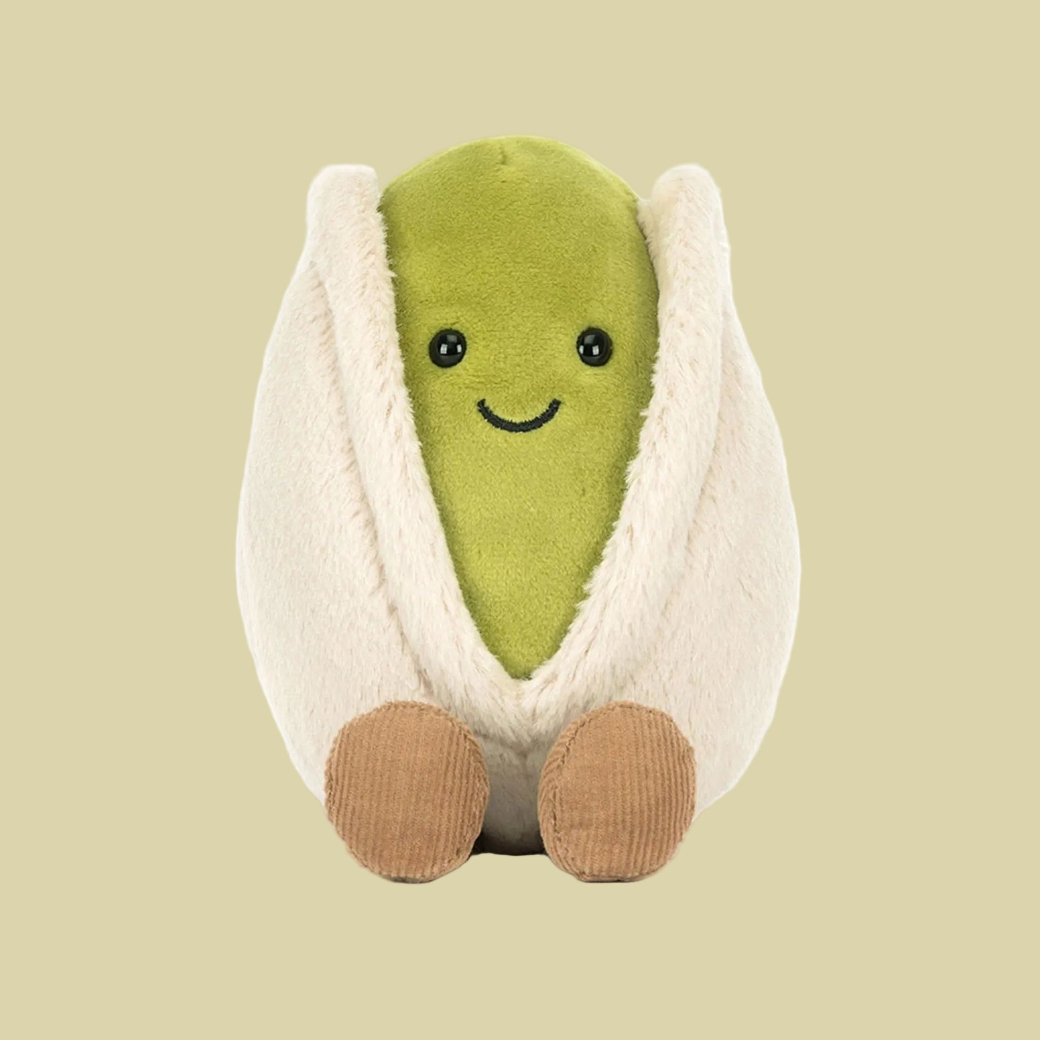 A pistachio shaped stuffed toy. 