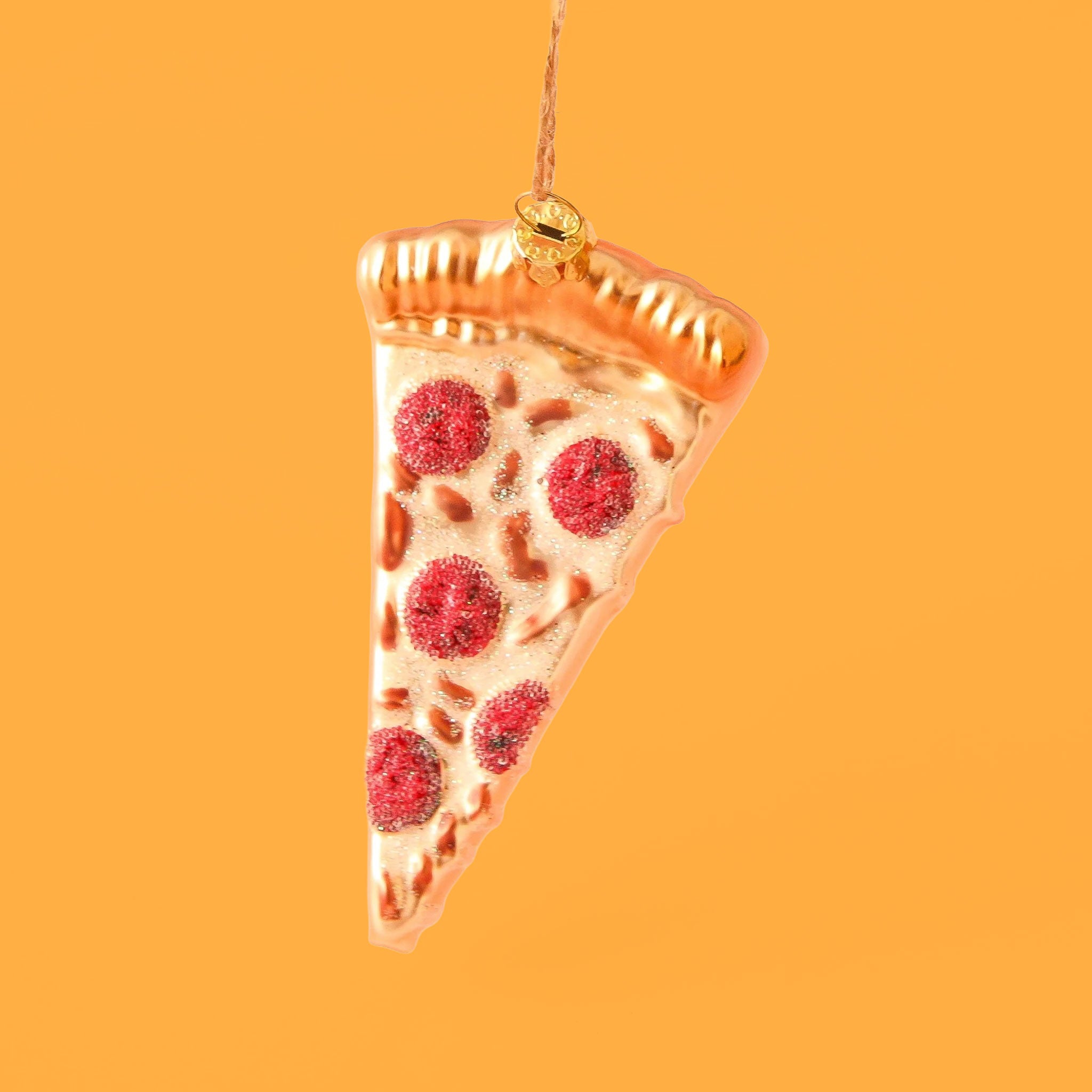 A slice of pepperoni pizza ornament with glittery cheese and golden crust. Metallic thread 3.5&quot; loop for hanging.
