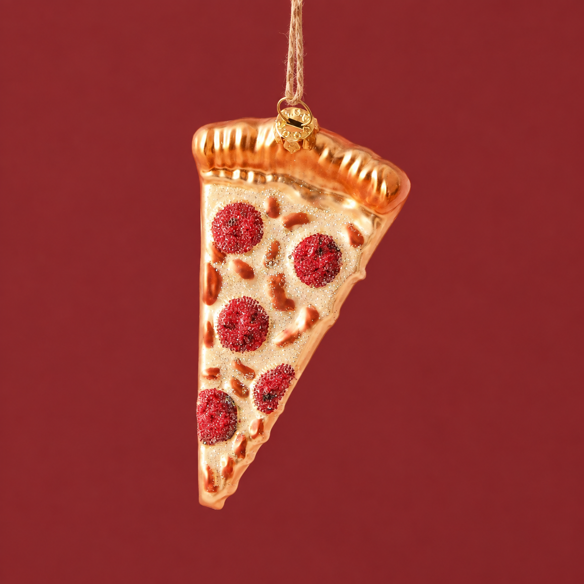 A slice of pepperoni pizza ornament with glittery cheese and golden crust. Metallic thread 3.5" loop for hanging.