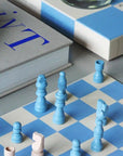 A blue and ivory checker board. 