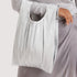 A silver chrome cinched drawstring pleated bag. 