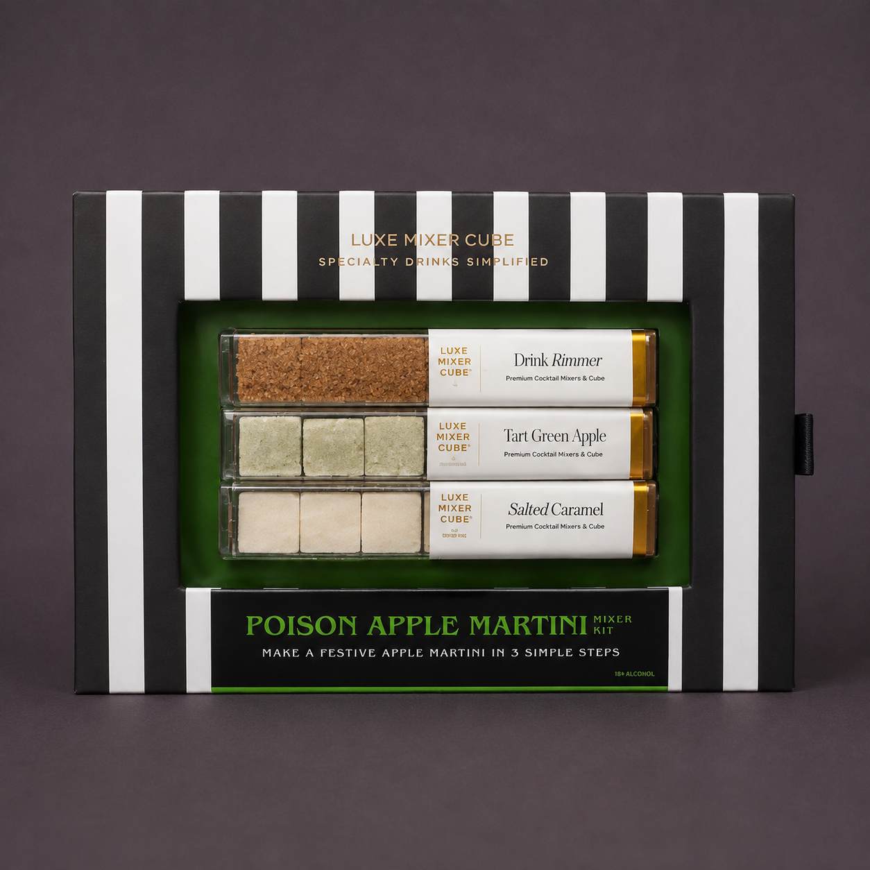 A boxed cocktail mixer cube set labeled 'Poison Apple Martini' with black-and-white striped packaging, a green inner tray, and three labeled cube packs visible through a clear window.