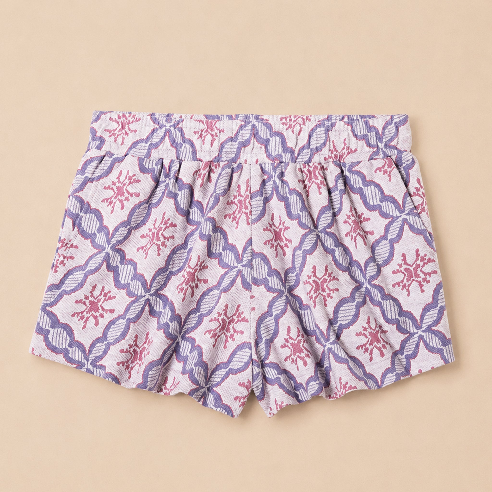 Patterned shorts on a beige background