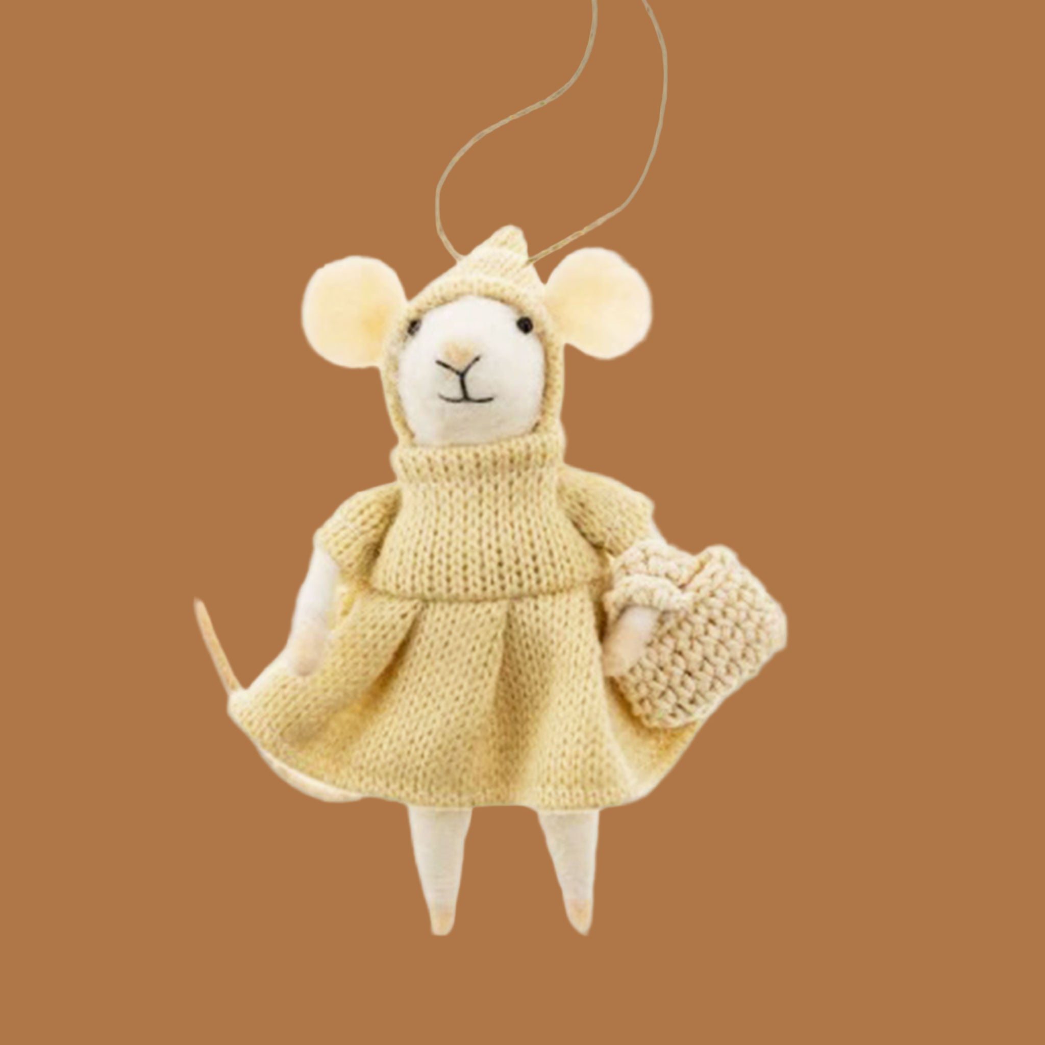 A white felt mouse ornament wearing a yellow bonnet and dress. 