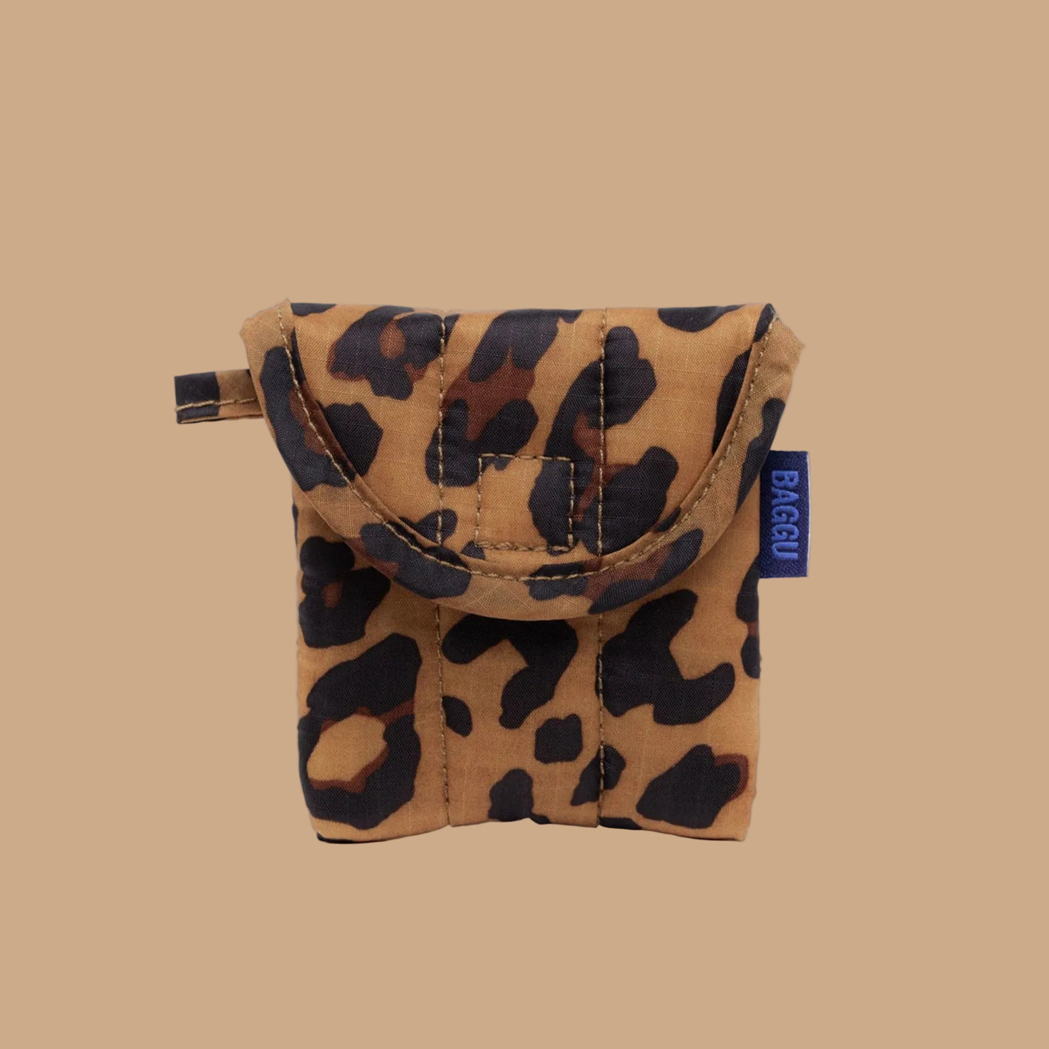 A brown and black leopard print earbud case. 