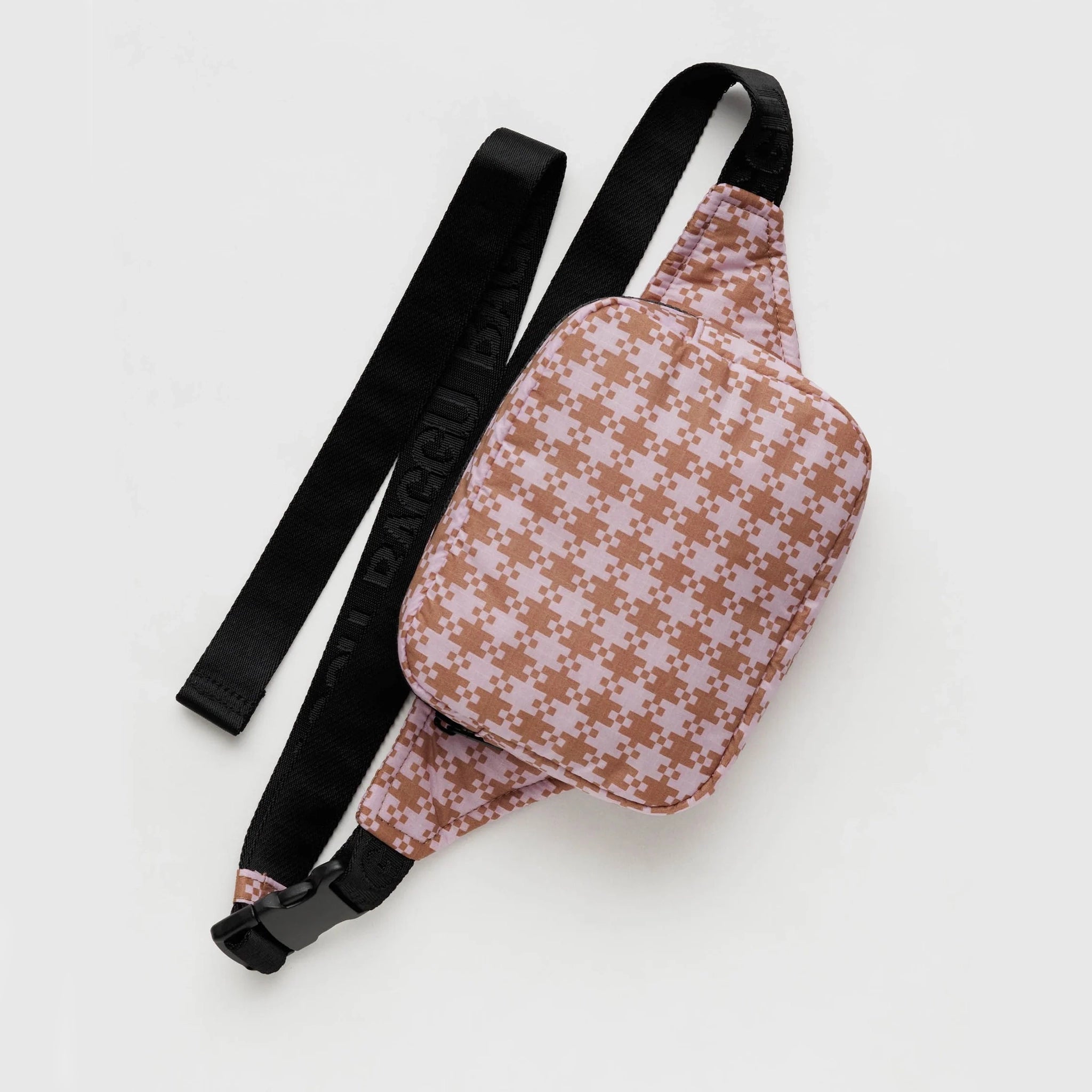 On a white background is a fanny pack with a brown and pink gingham pattern and a black adjustable strap.