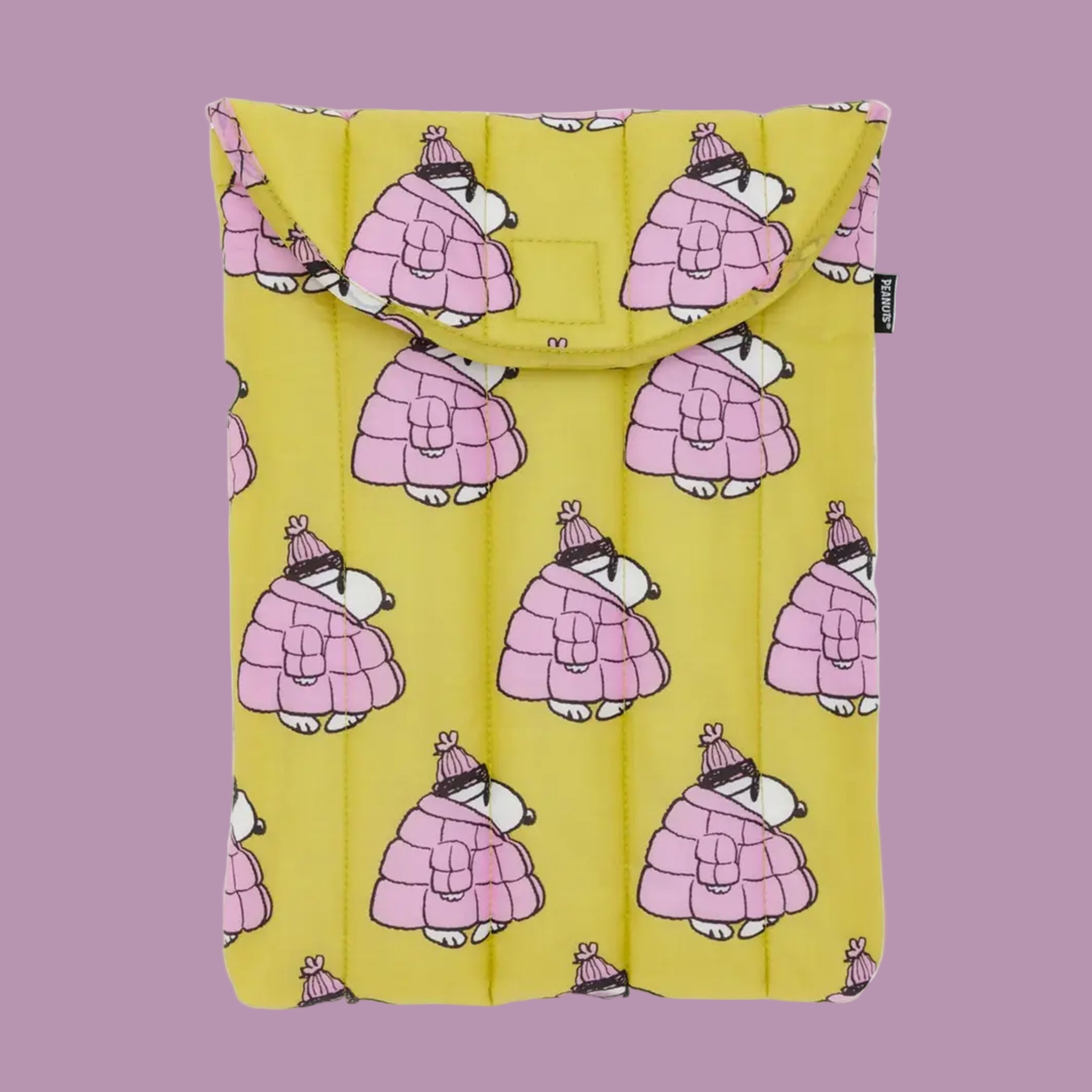 A chartreuse colored puffy laptop case with a pattern of Snoopy in a pink puffer coat.  