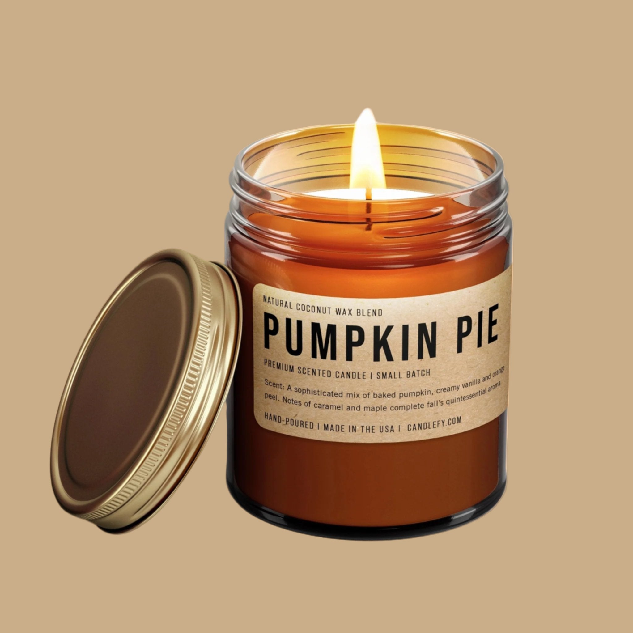A brown glass jar with a label that reads, 'Pumpkin Pie' and a gold lid. 