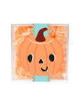 A clear acrylic colored box of orange sour star candies with a pumpkin graphic on the front. 