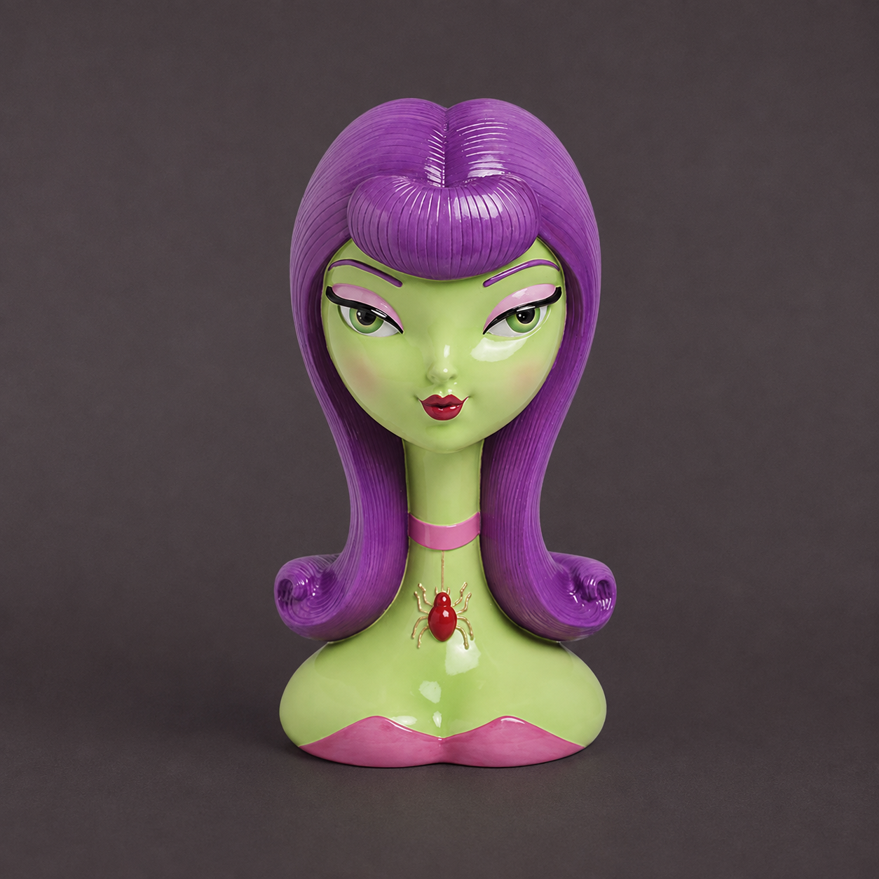 A stylized bust sculpture of a female character with long purple hair, green skin, and a pink collar featuring a red jewel, set against a solid dark gray background.