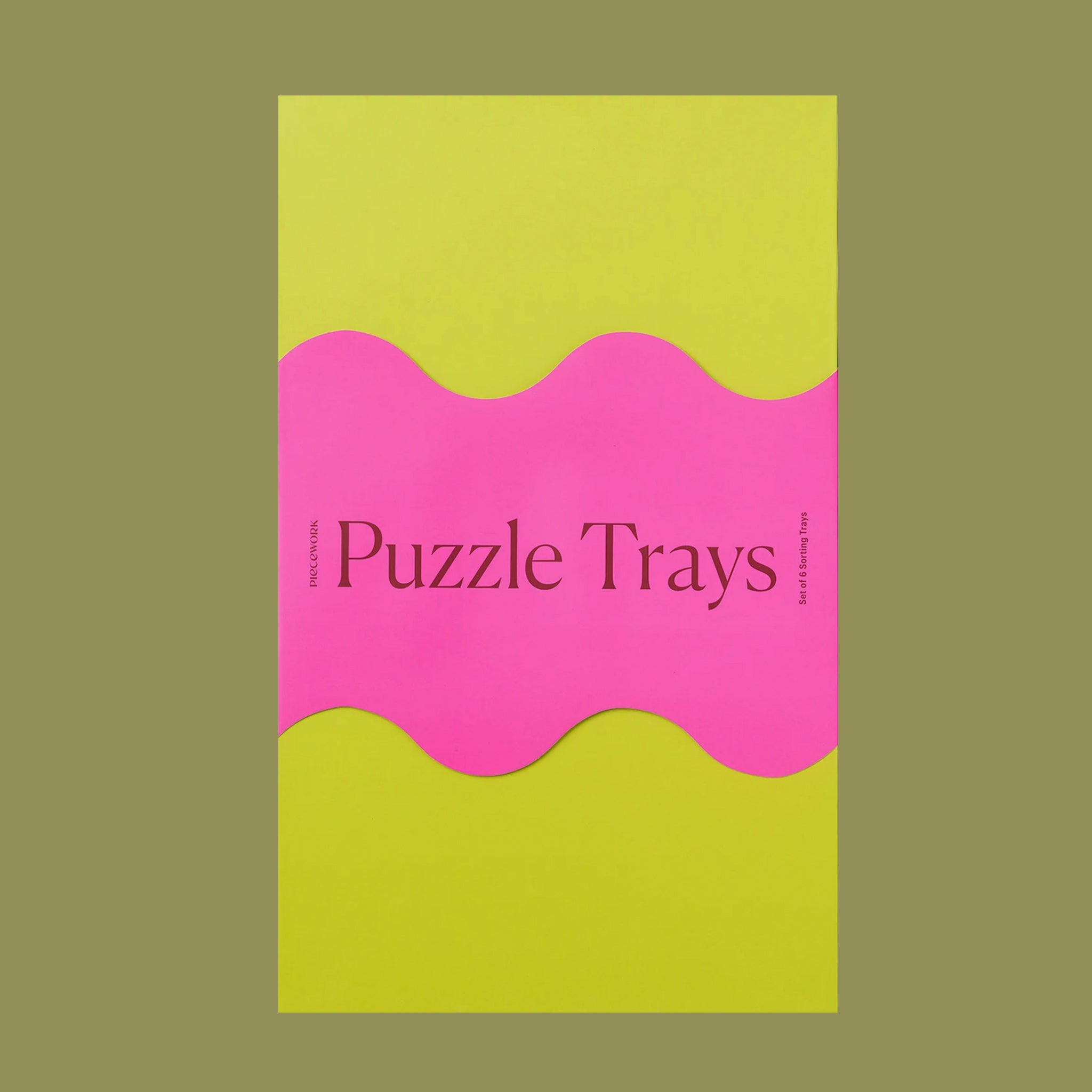 A set of 6 trays in vibrant colors for sorting through puzzle pieces. Puzzle sold separately. 