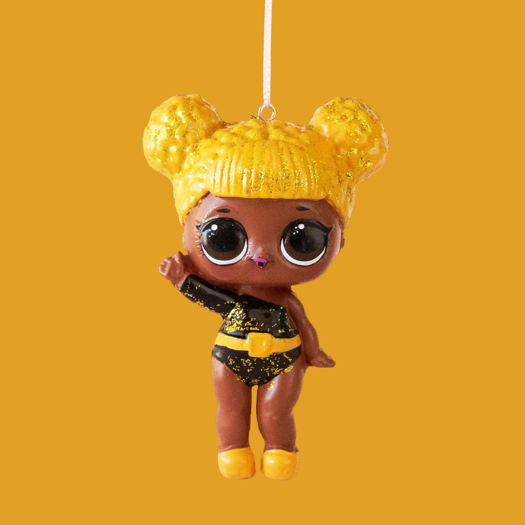 A LOL doll shaped ornament with yellow hair and a black and yellow outfit. 