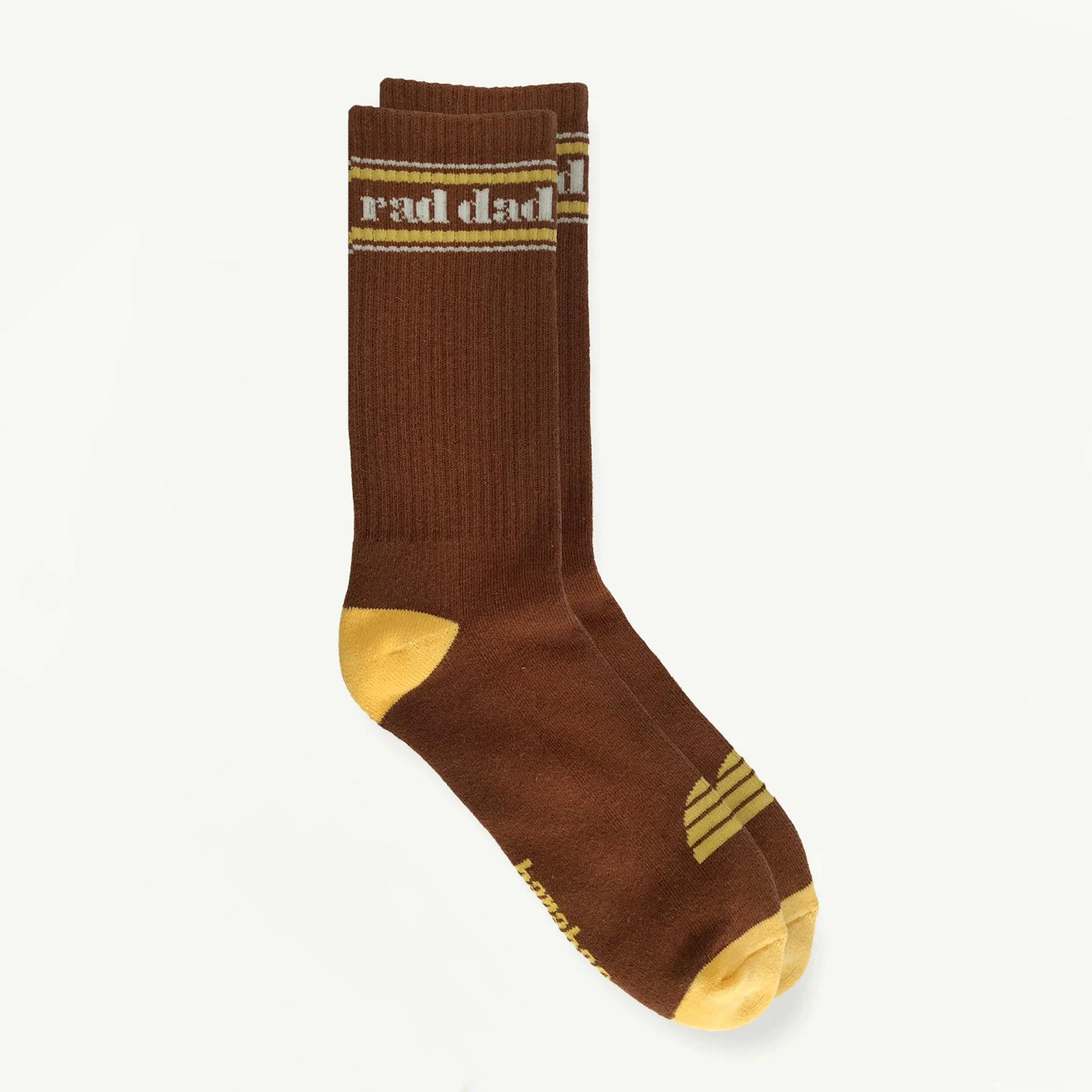 A pair of brown and yellow socks with white text at the top that reads, &quot;rad dad&quot;.