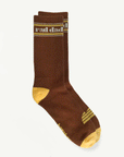 A pair of brown and yellow socks with white text at the top that reads, "rad dad".