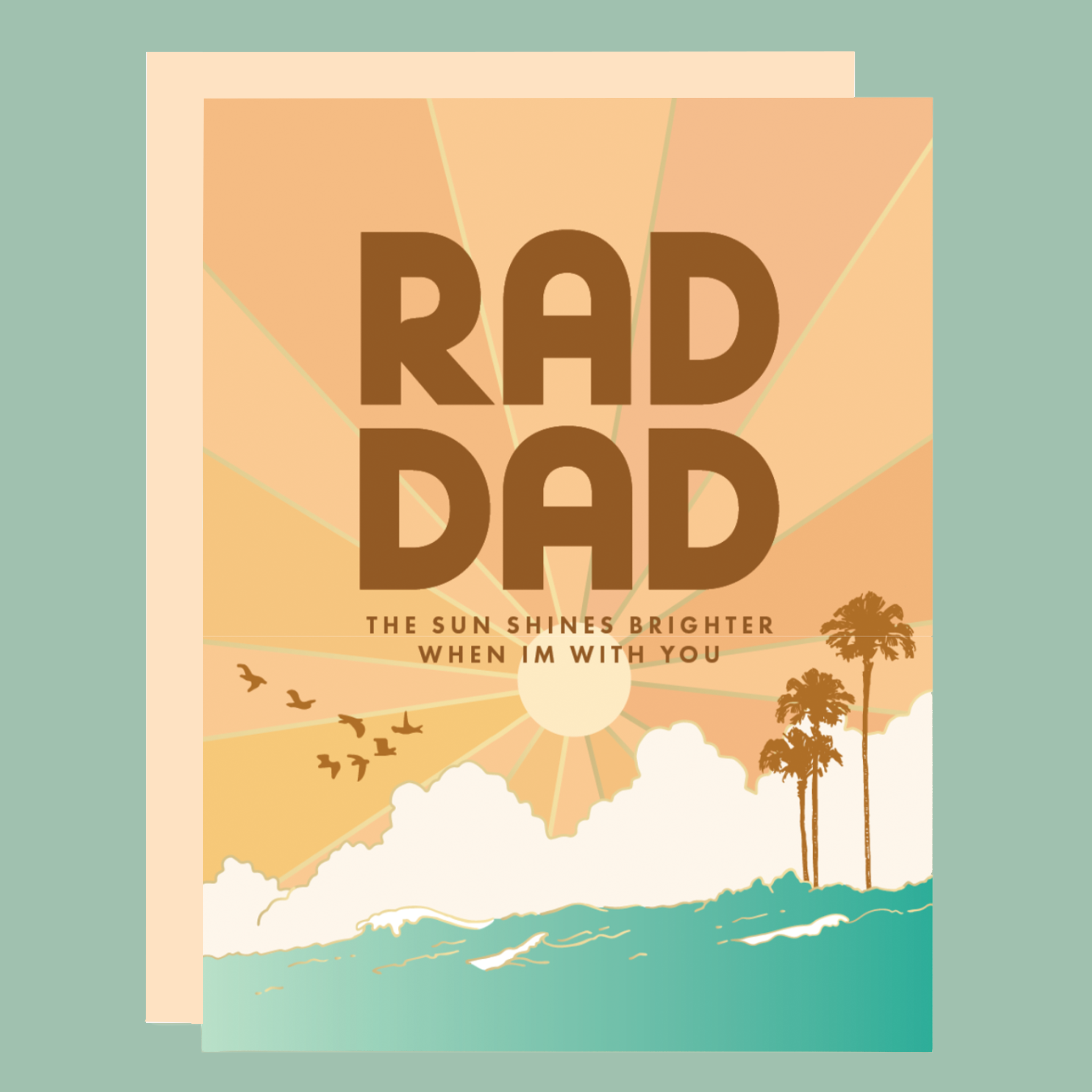 Illustrated greeting card with retro sunset design reading “RAD DAD” and “The sun shines brighter when I’m with you,” featuring a golden sun, clouds, birds in flight, ocean waves, and palm trees in warm orange and teal tones.