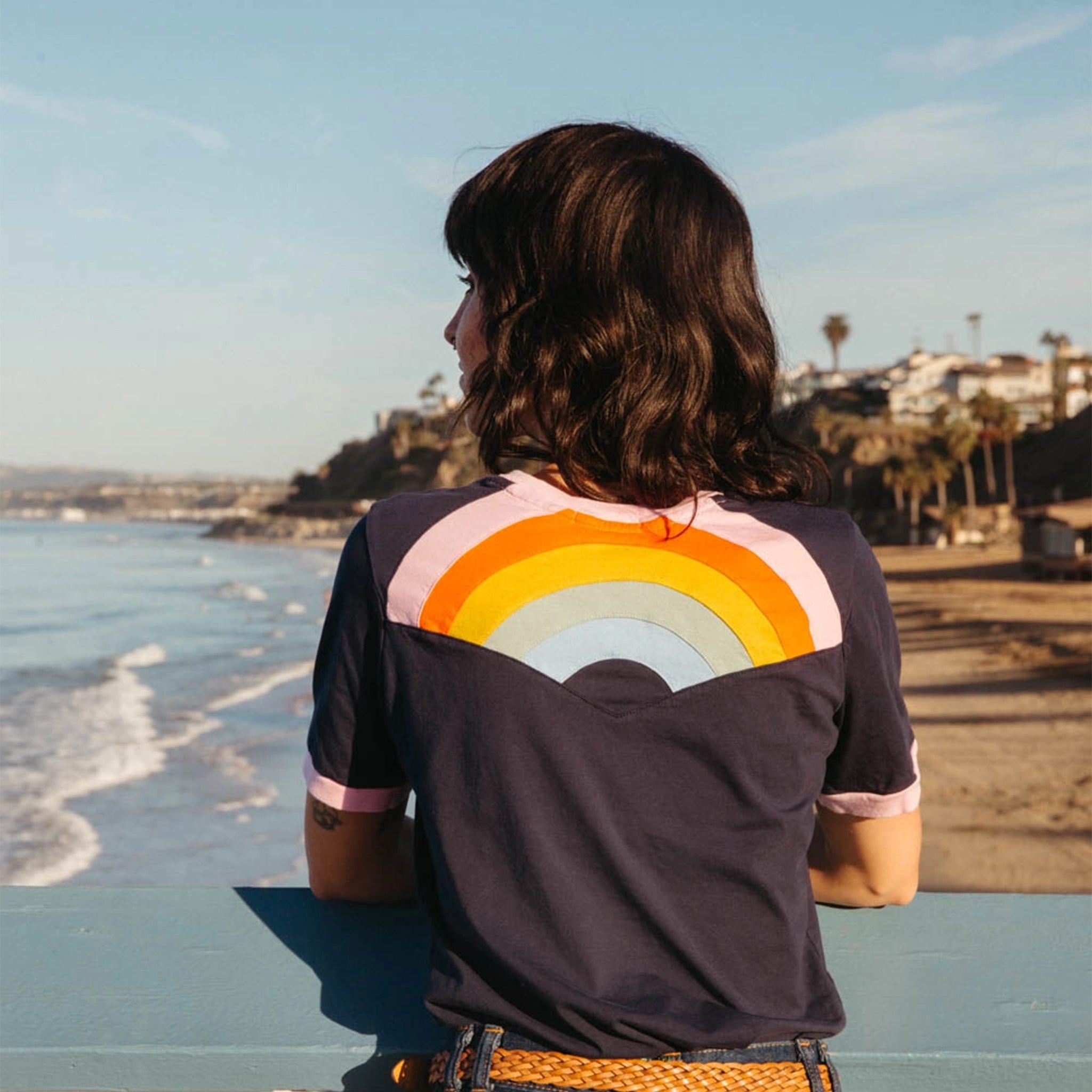 A ringer tee with a rainbow embroidery on the back. 
