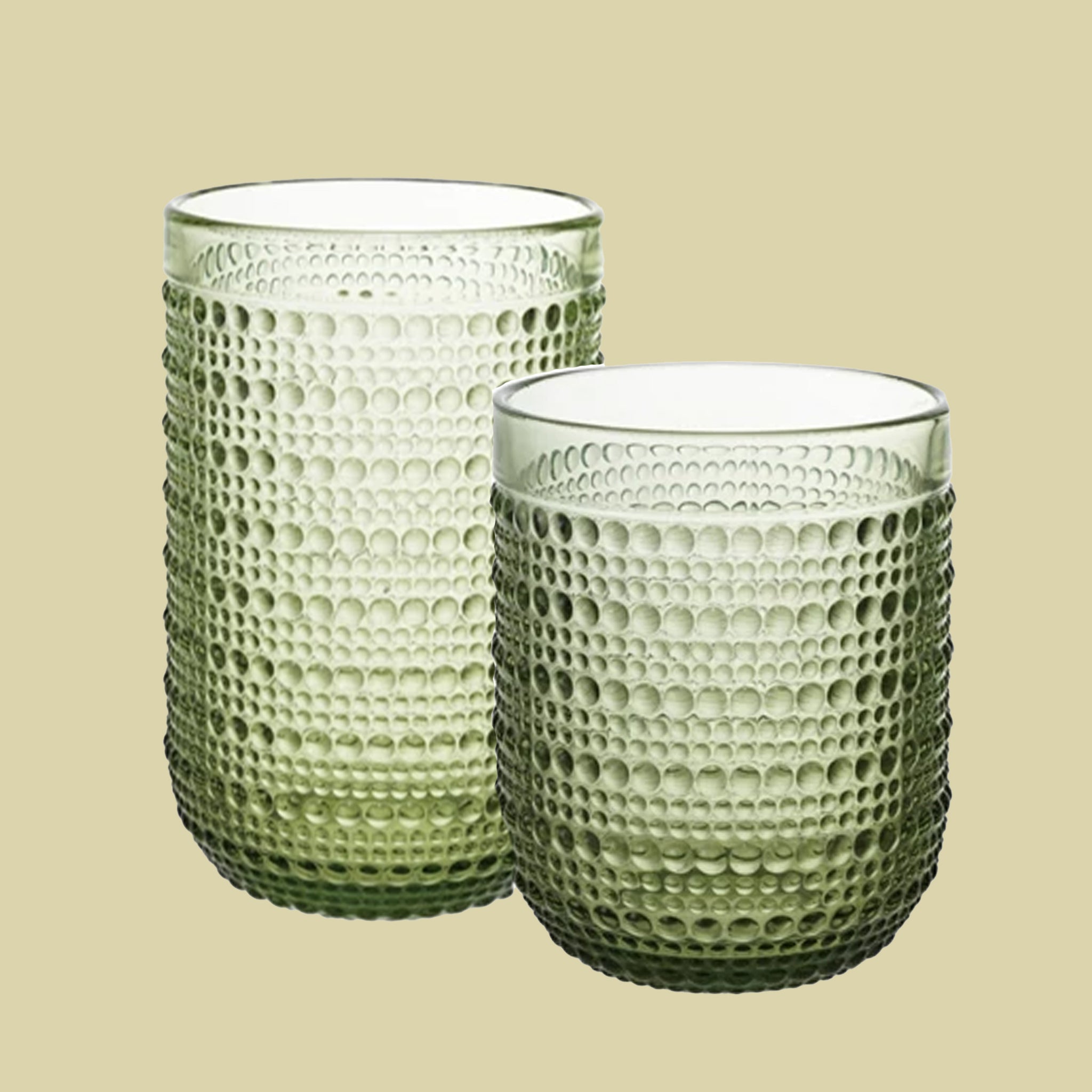 A green raised dot drinking glass available in two sizes. Each sold separately. 