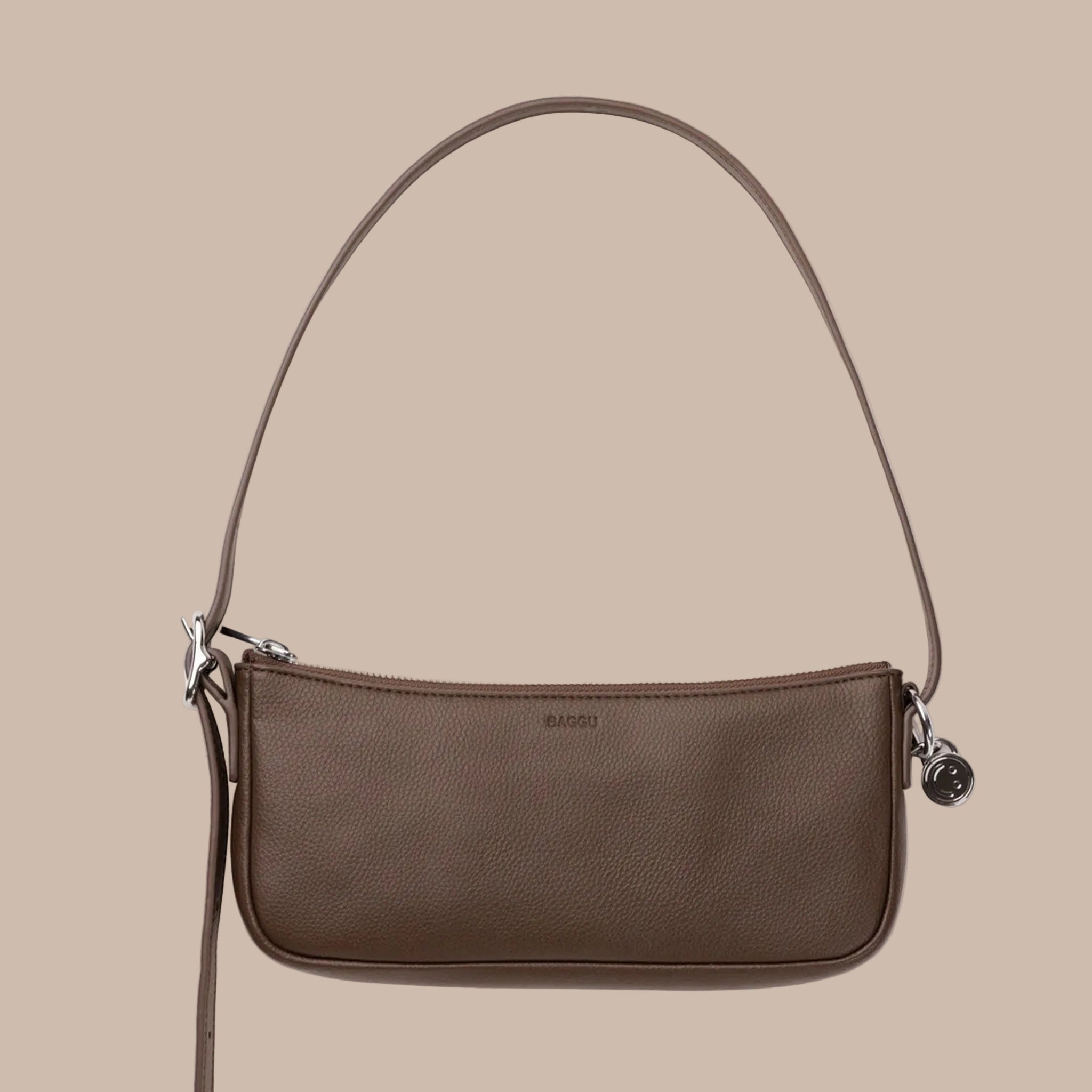 A brown recycled leather mini shoulder bag. 