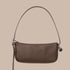 A brown recycled leather mini shoulder bag.