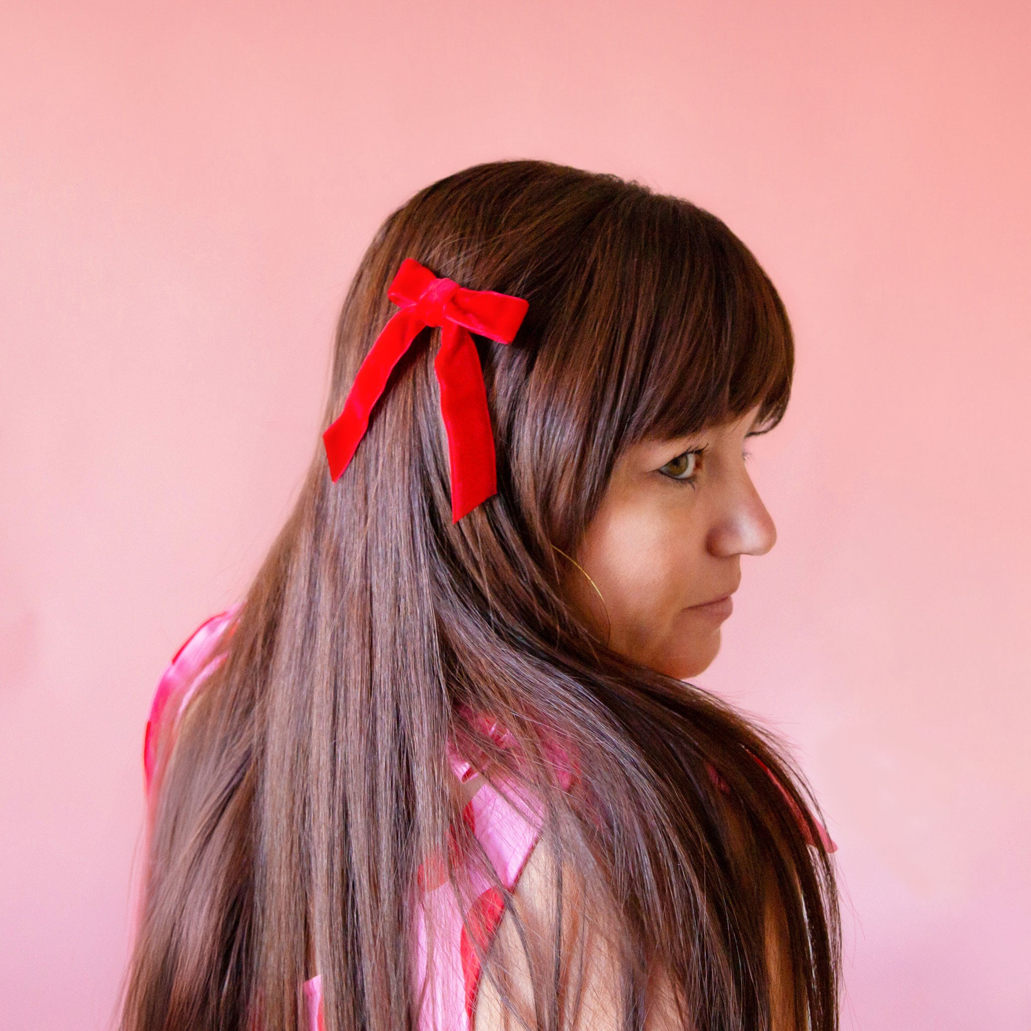 A set of red hair bows. 