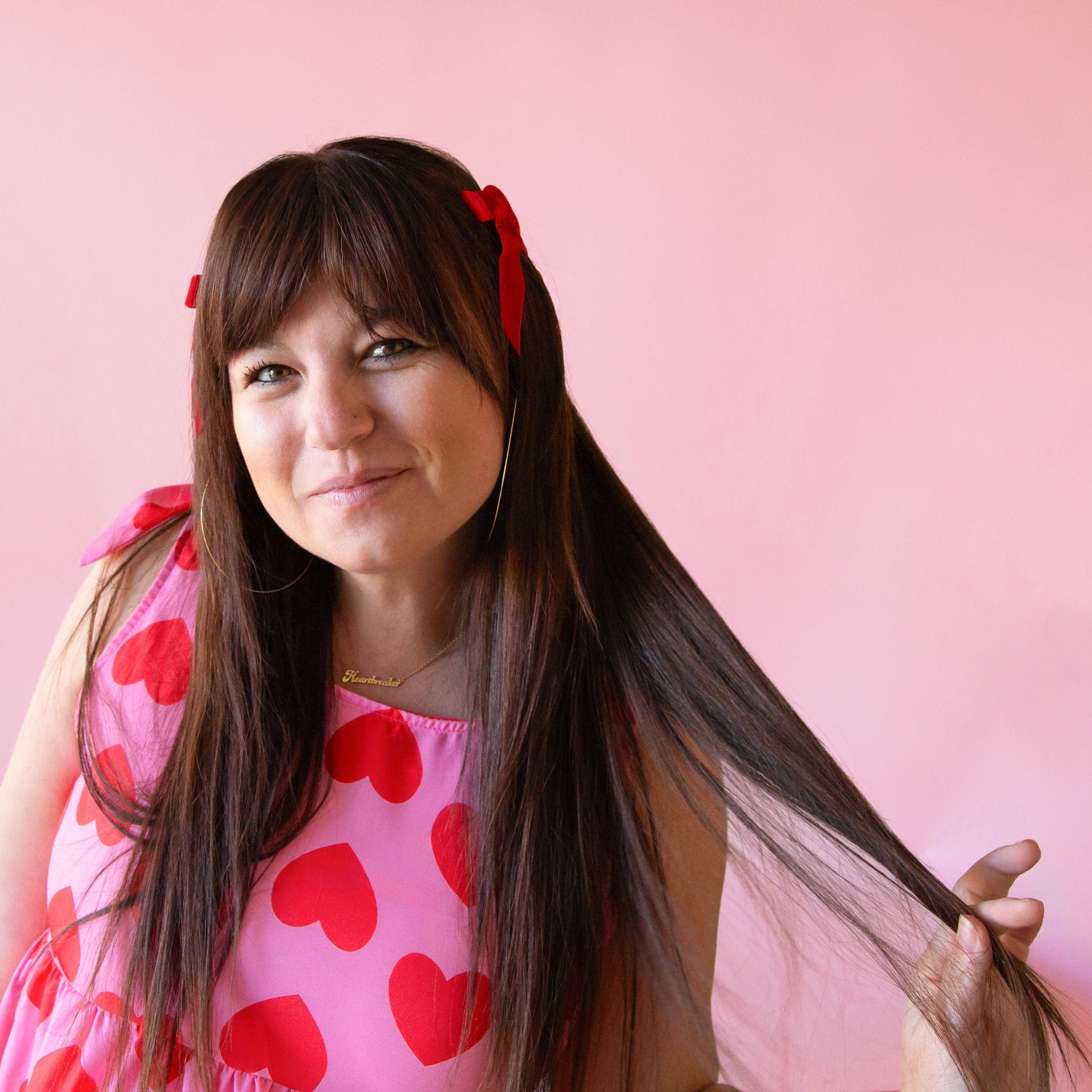 A set of red hair bows. 