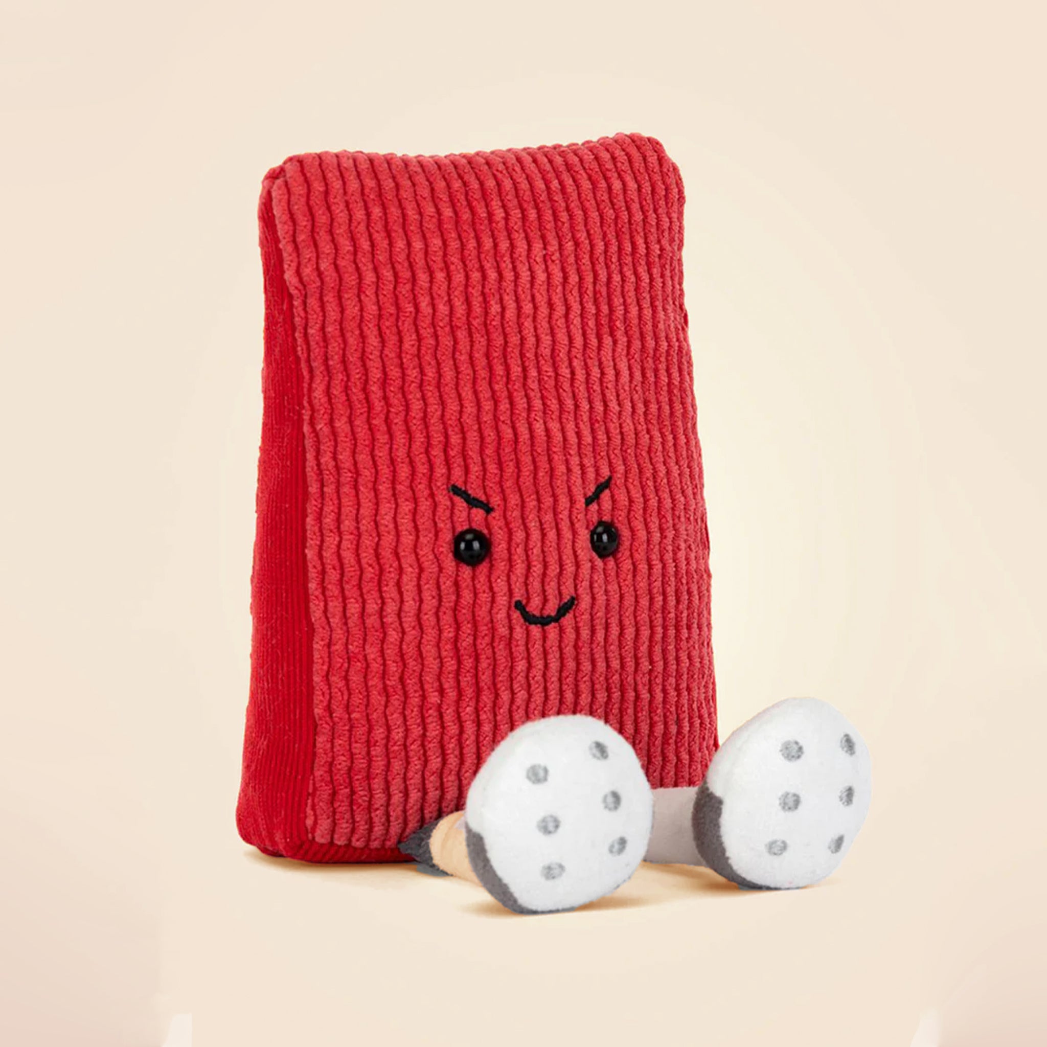 A red card shaped plush toy. 