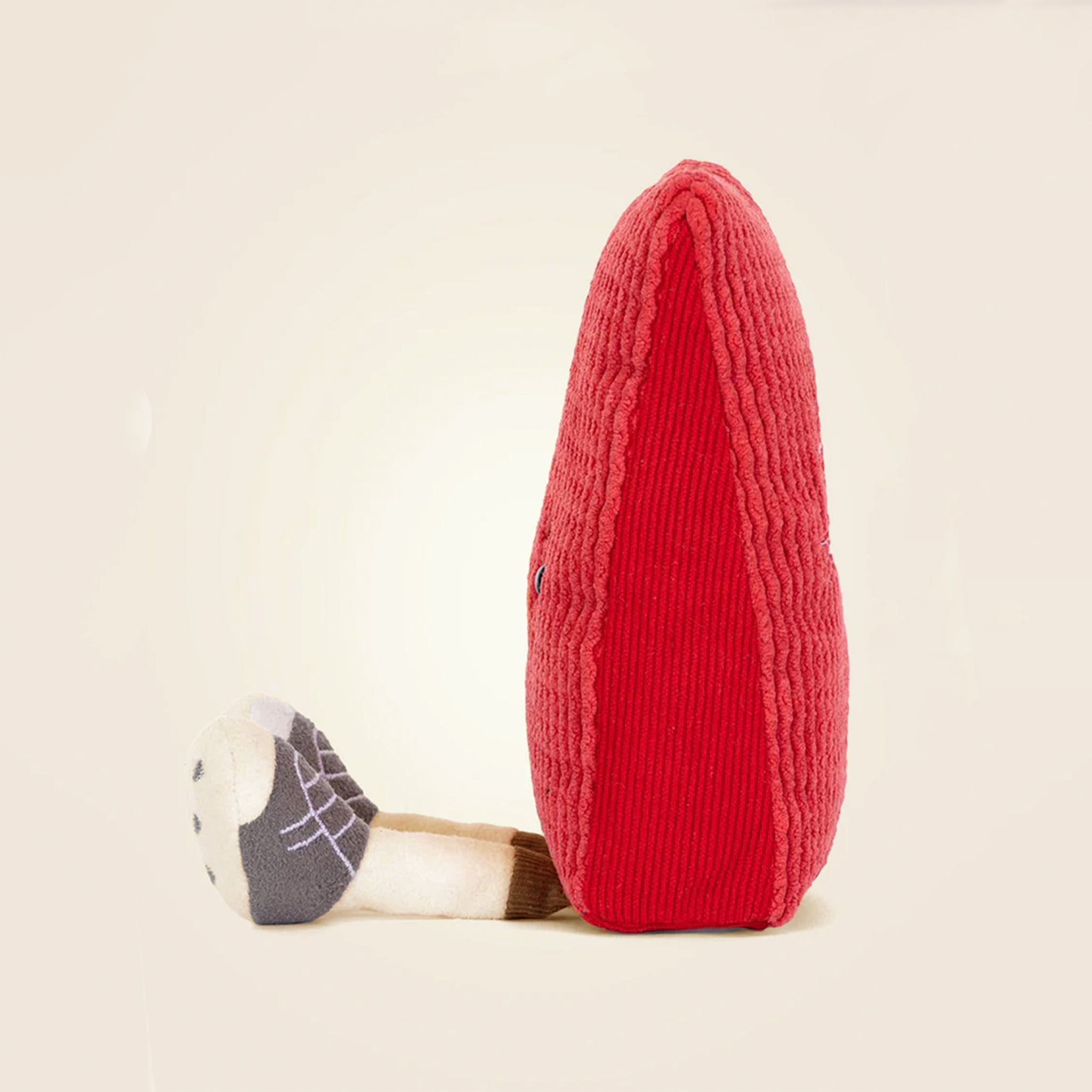 A red card shaped plush toy. 